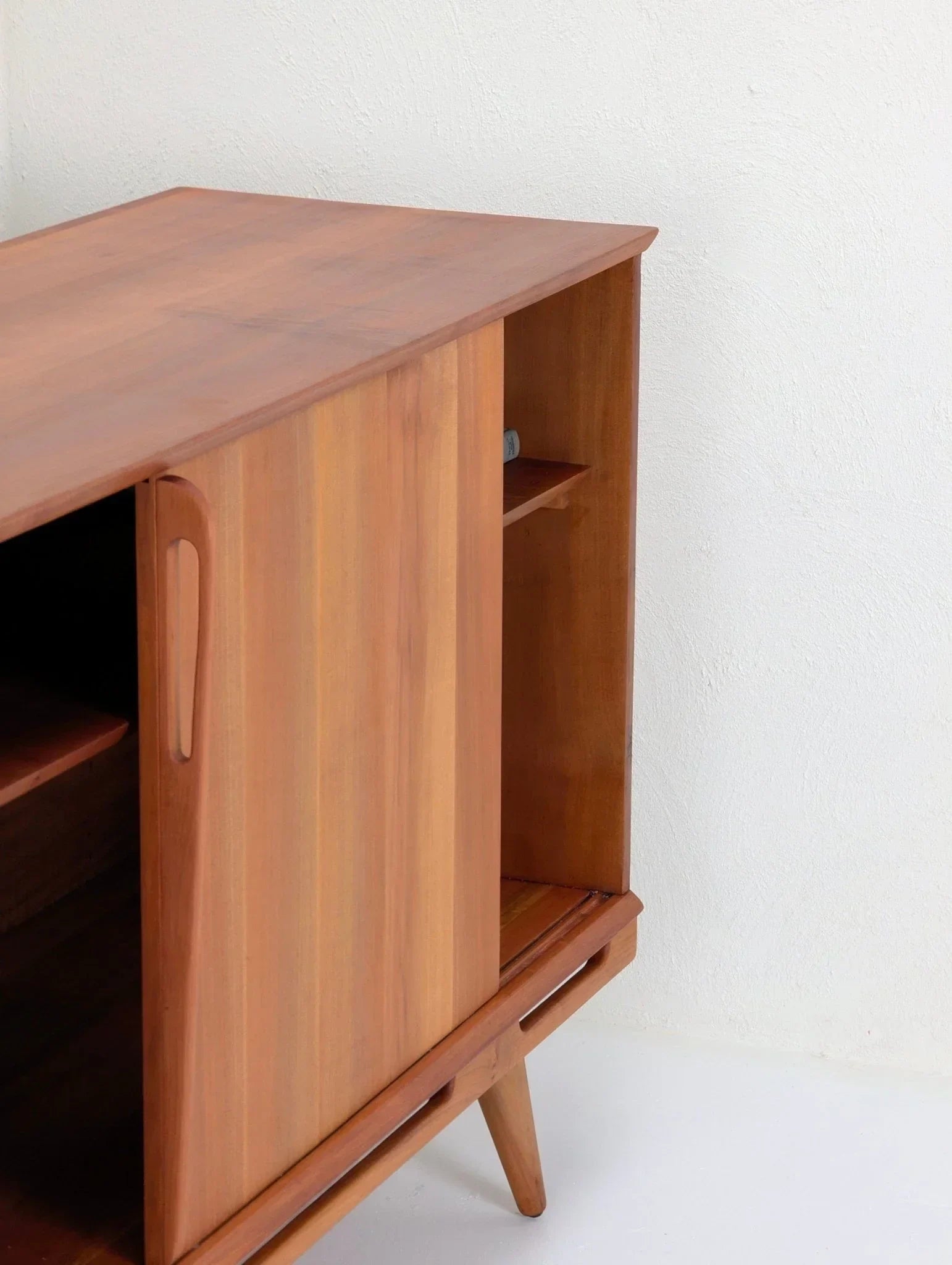 1950s Tasmanian myrtle wood sideboard with sliding door and tapered legs