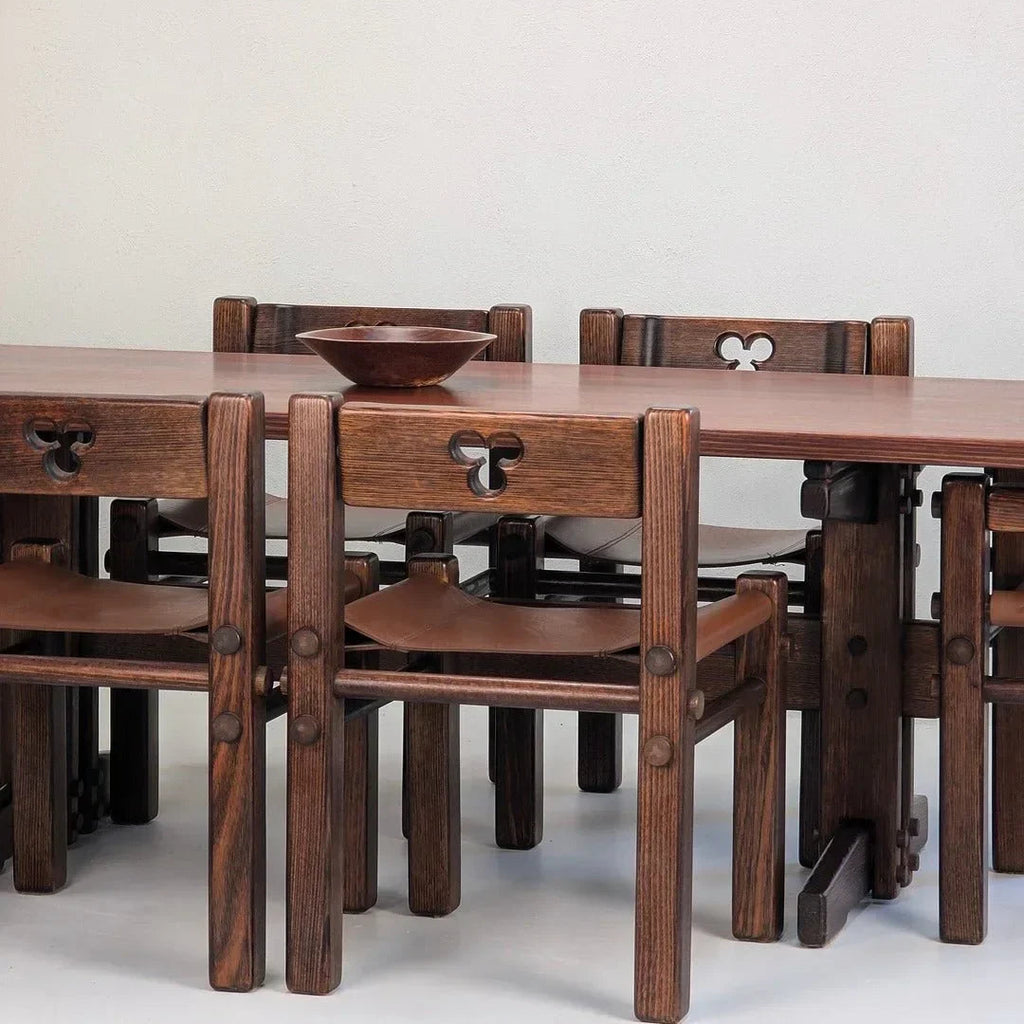 1970s Alpine ash dining table with matching chairs and carved backs, minimalist setting