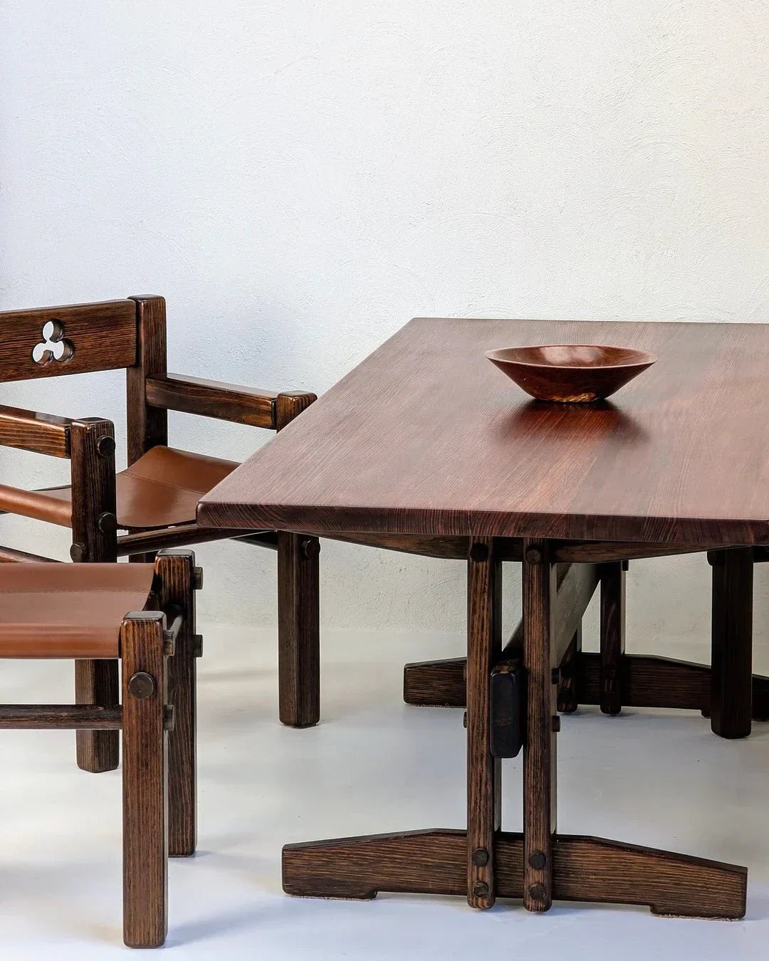 1970s Alpine ash dining table with wood chairs, leather seats, and a wooden bowl