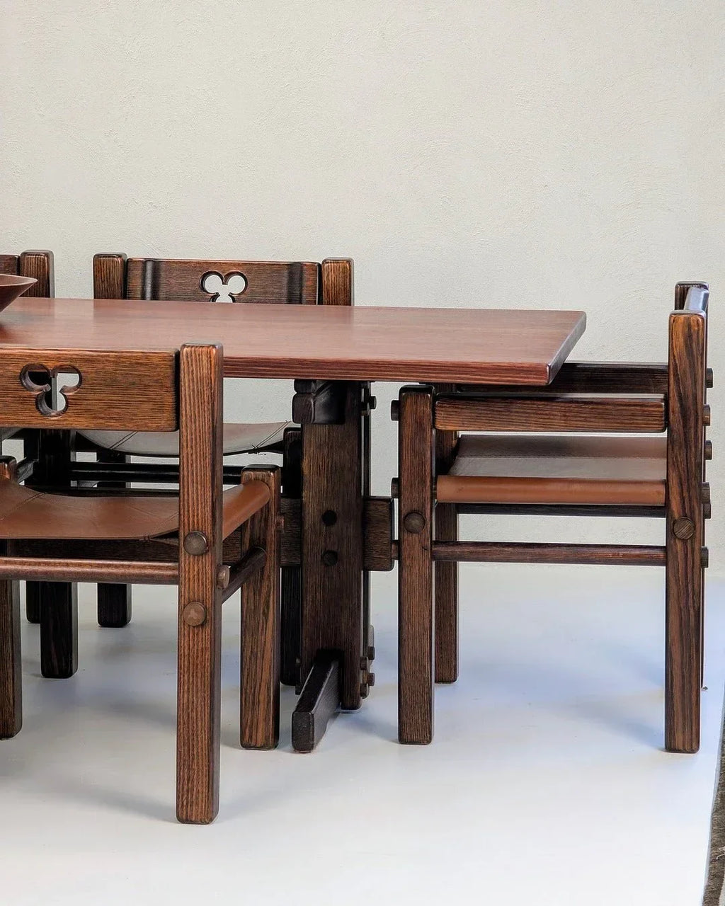 1970s Alpine ash dining table with matching wooden chairs, set on a light background