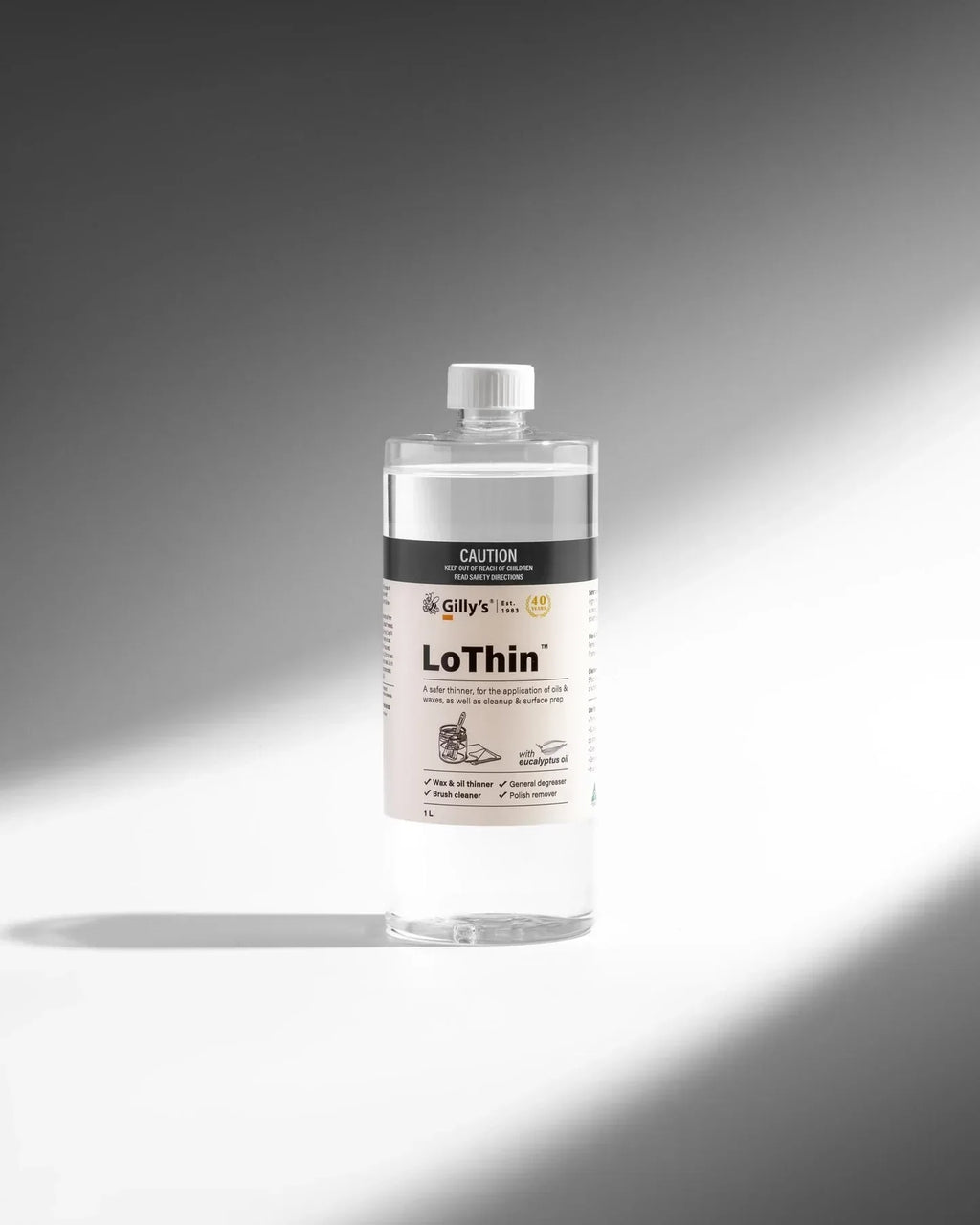 Gilly's LoThin 1L bottle cleaner and thinner on a white and gray gradient background