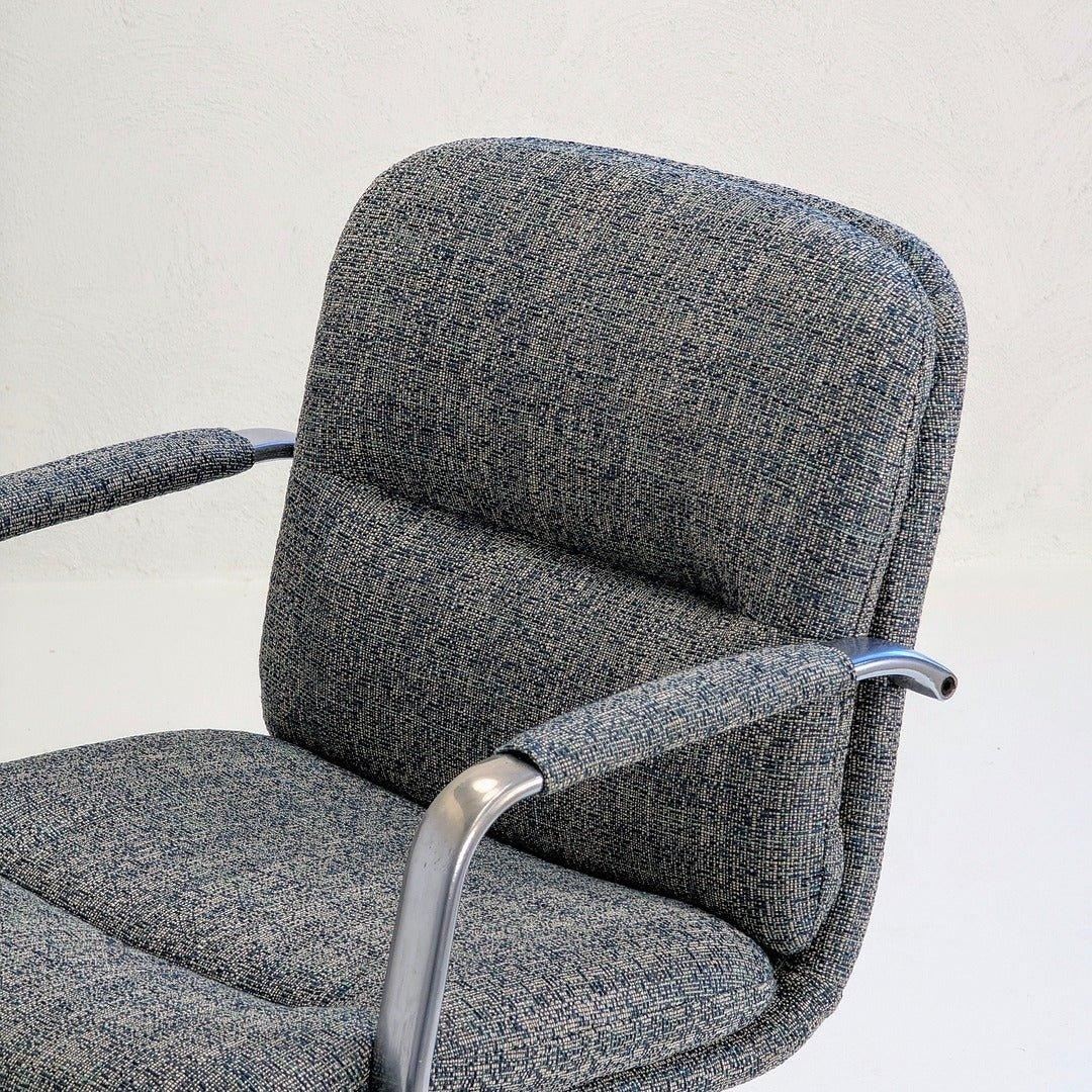 80s executive swivel armchair with textured wool upholstery and chrome armrests
