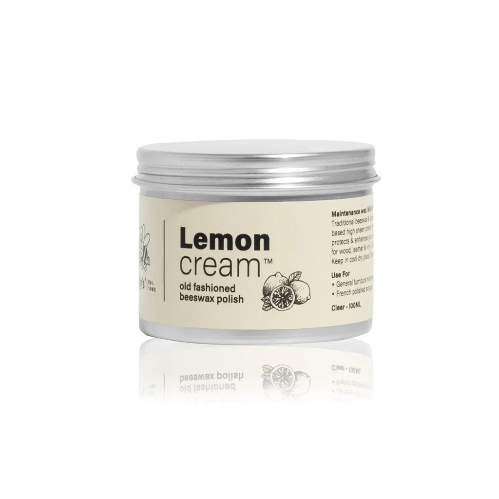 Lemon cream old fashioned beeswax polish 100ml jar with silver lid on white background