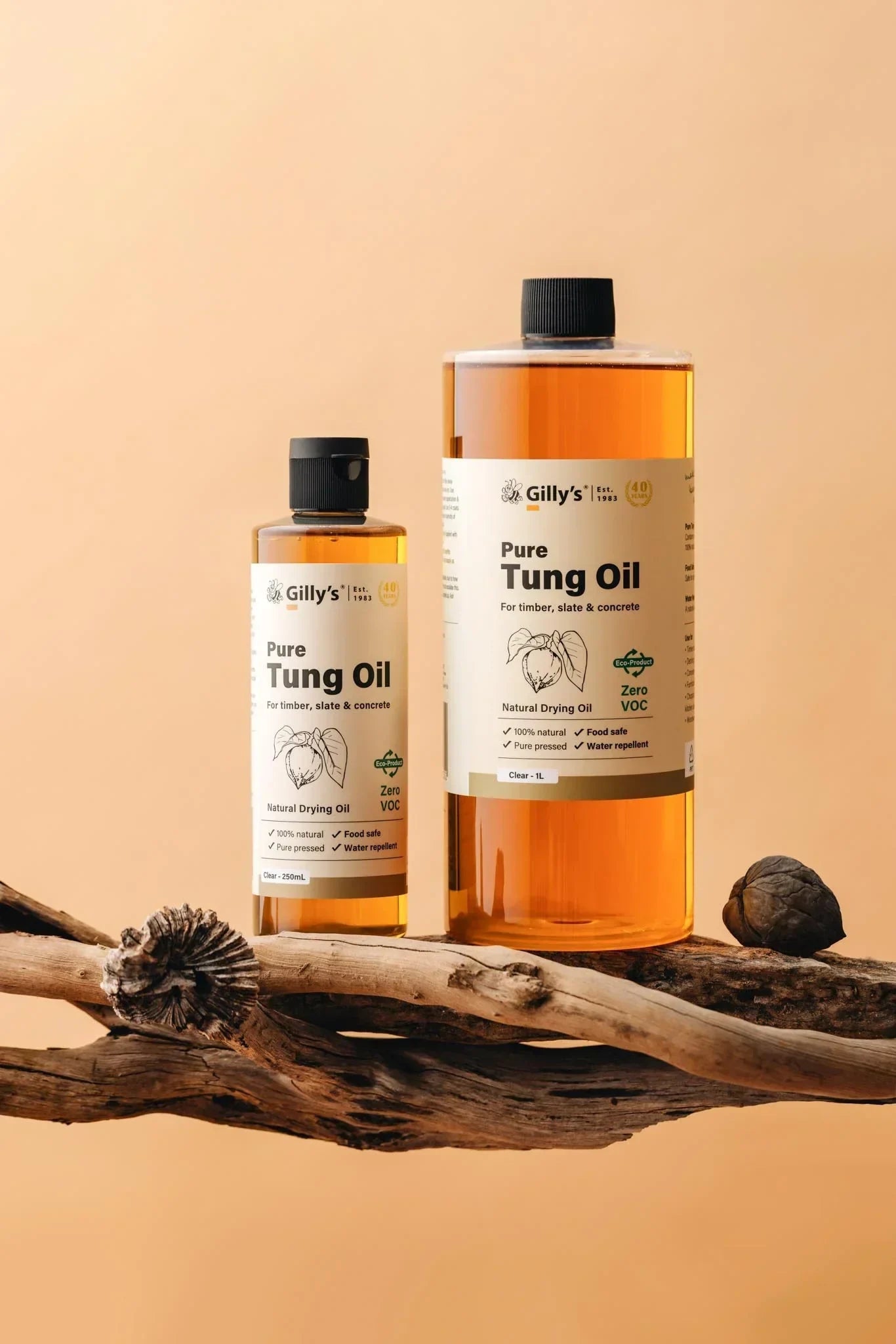 Gilly's Pure Tung Oil bottles on wood with tung nut, natural finish product for timber