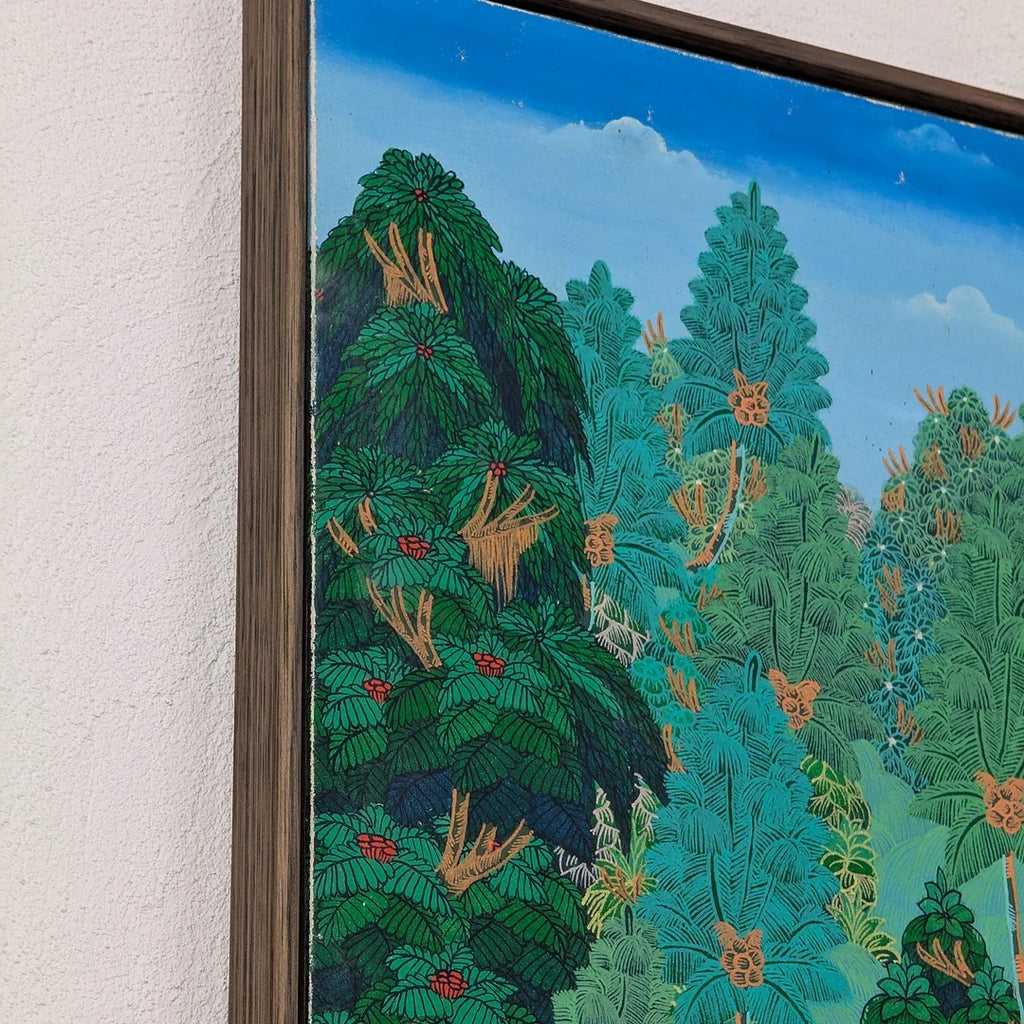 Framed painting of lush green and blue foliage with red and orange floral accents under a blue sky