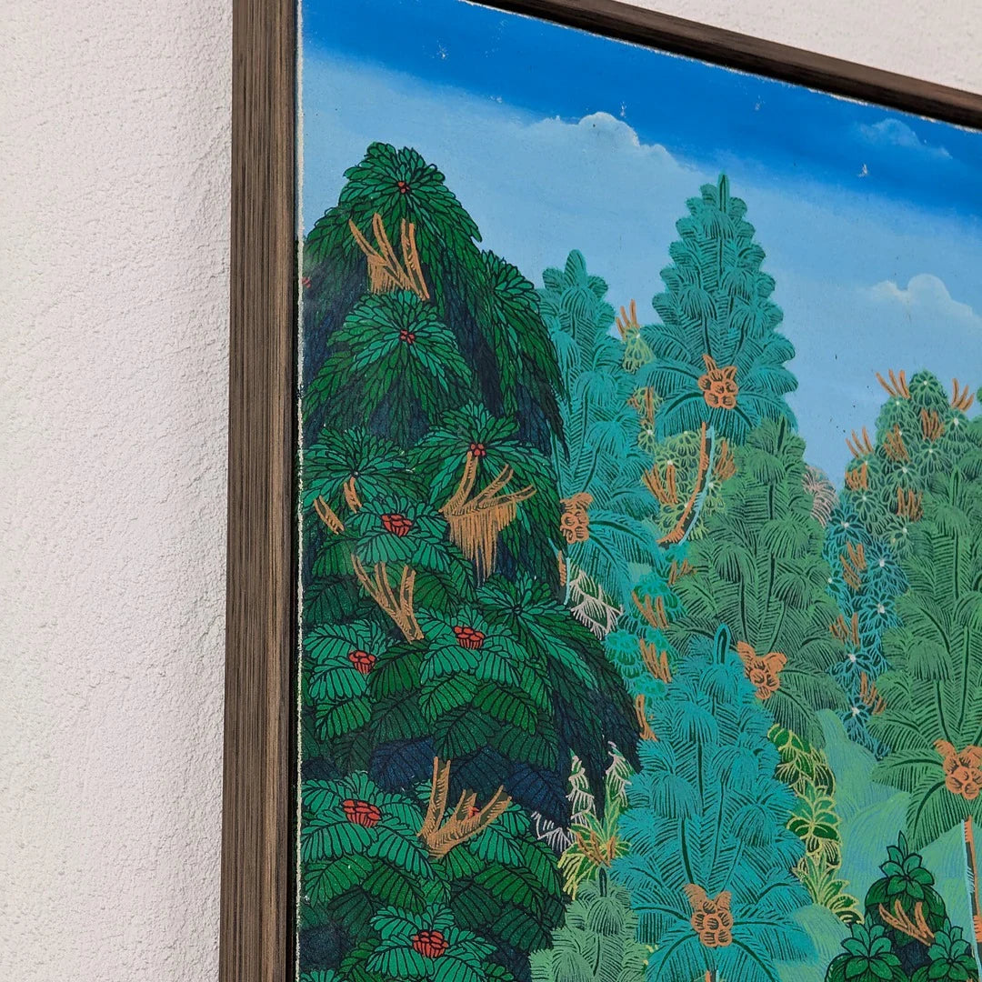 Framed painting of lush green and blue foliage with red and orange floral accents under a blue sky