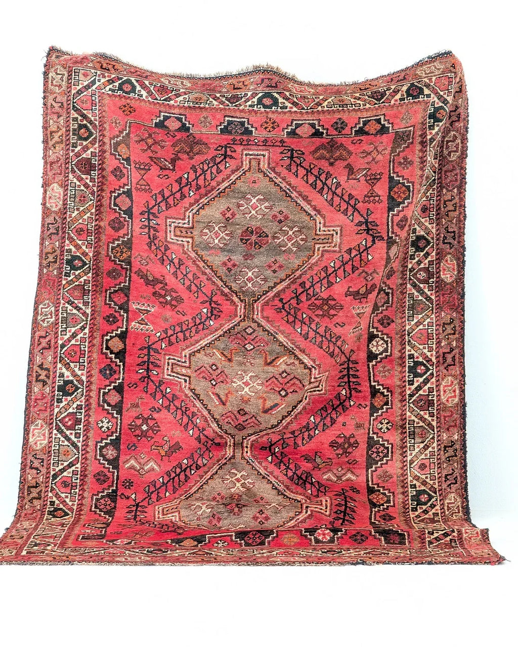 Vintage red Persian rug with geometric patterns and intricate traditional designs