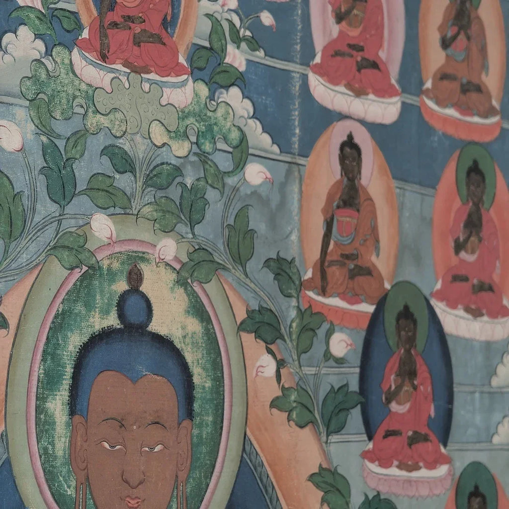 Tibetan Buddhist thangka painting with multiple meditating buddhas on a blue floral background