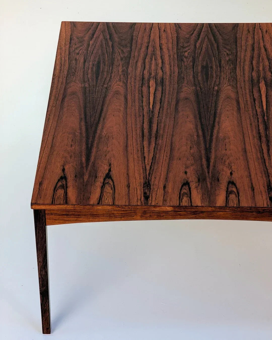 Mid-century modern rosewood table with striking natural wood grain pattern