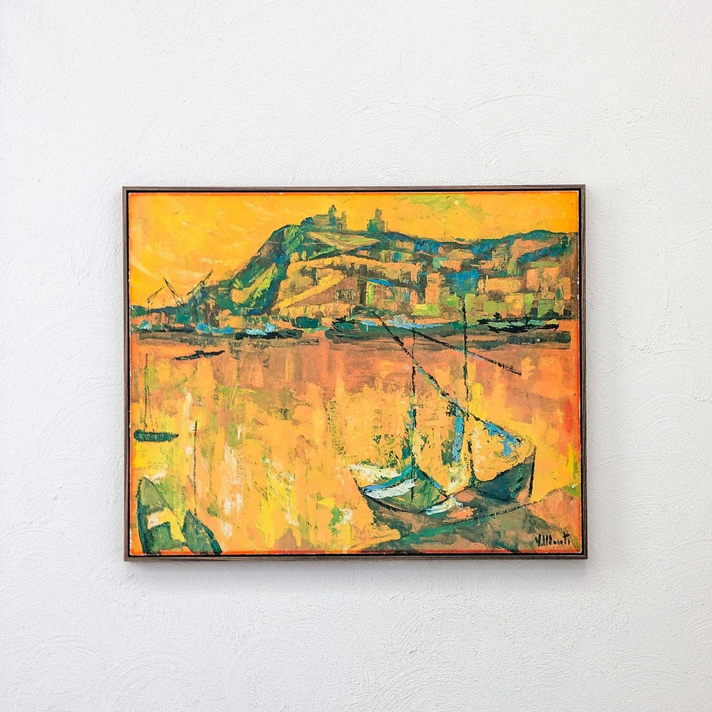 Framed abstract painting of boats on water with a vibrant yellow-orange background and distant hills