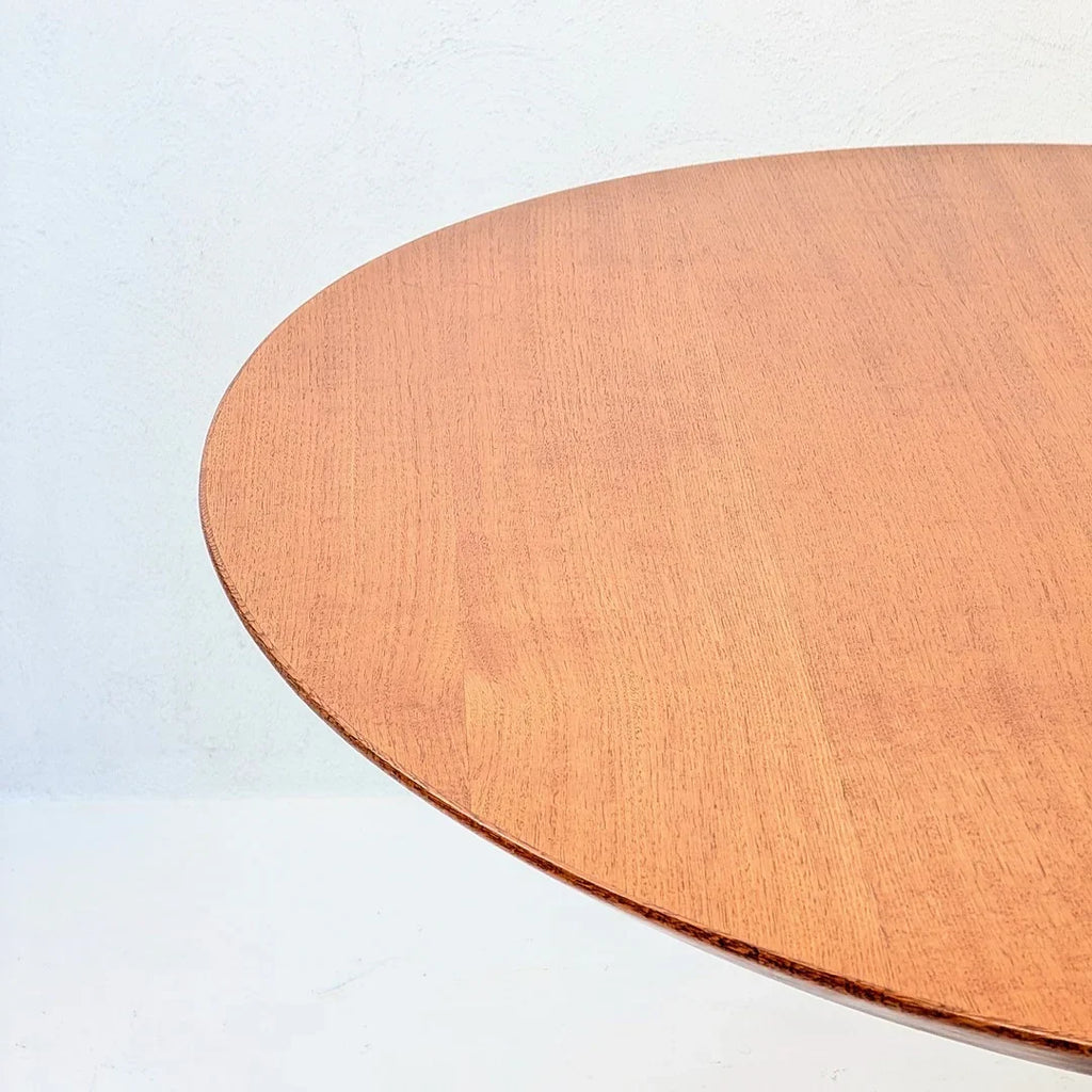 Round light wood tabletop on white background, minimalist furniture design