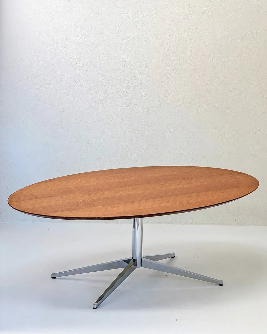 Florence Knoll Model 2480 oval oak table with chrome base in minimalist room