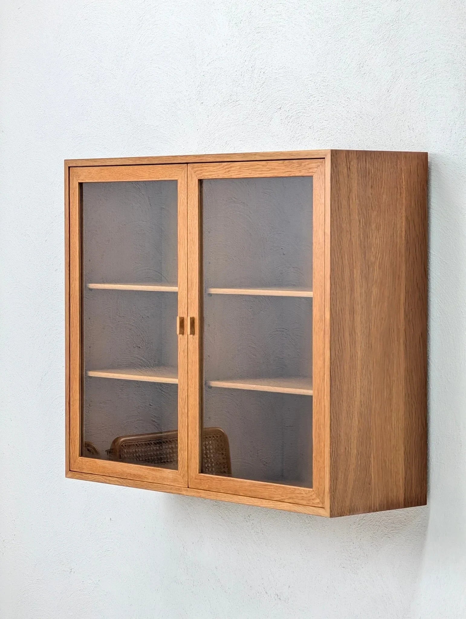 Mid-century Danish oak and glass wall display cabinet with two shelves and double doors