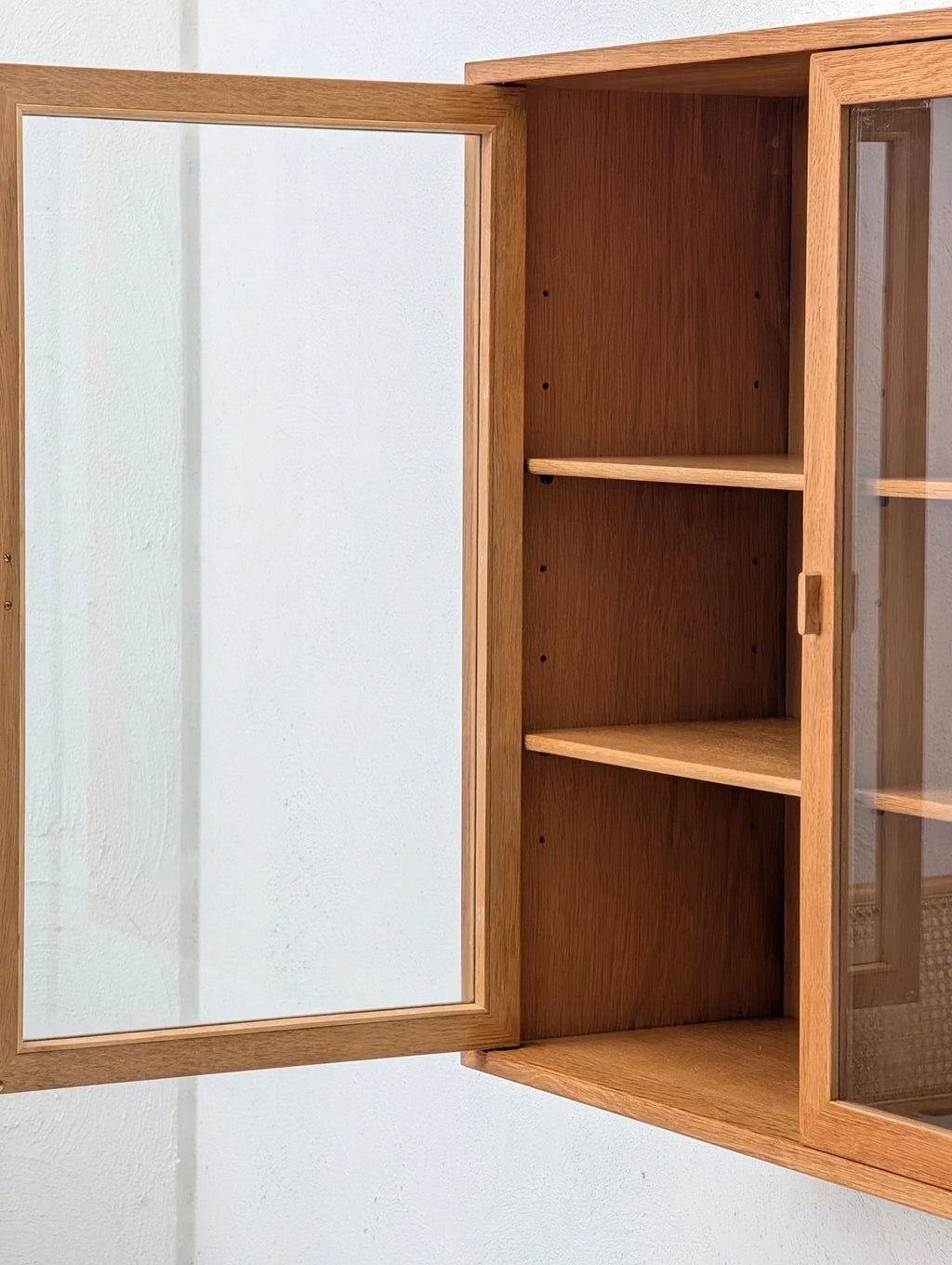 Mid-century oak and glass display cabinet with open door and shelves, Danish design