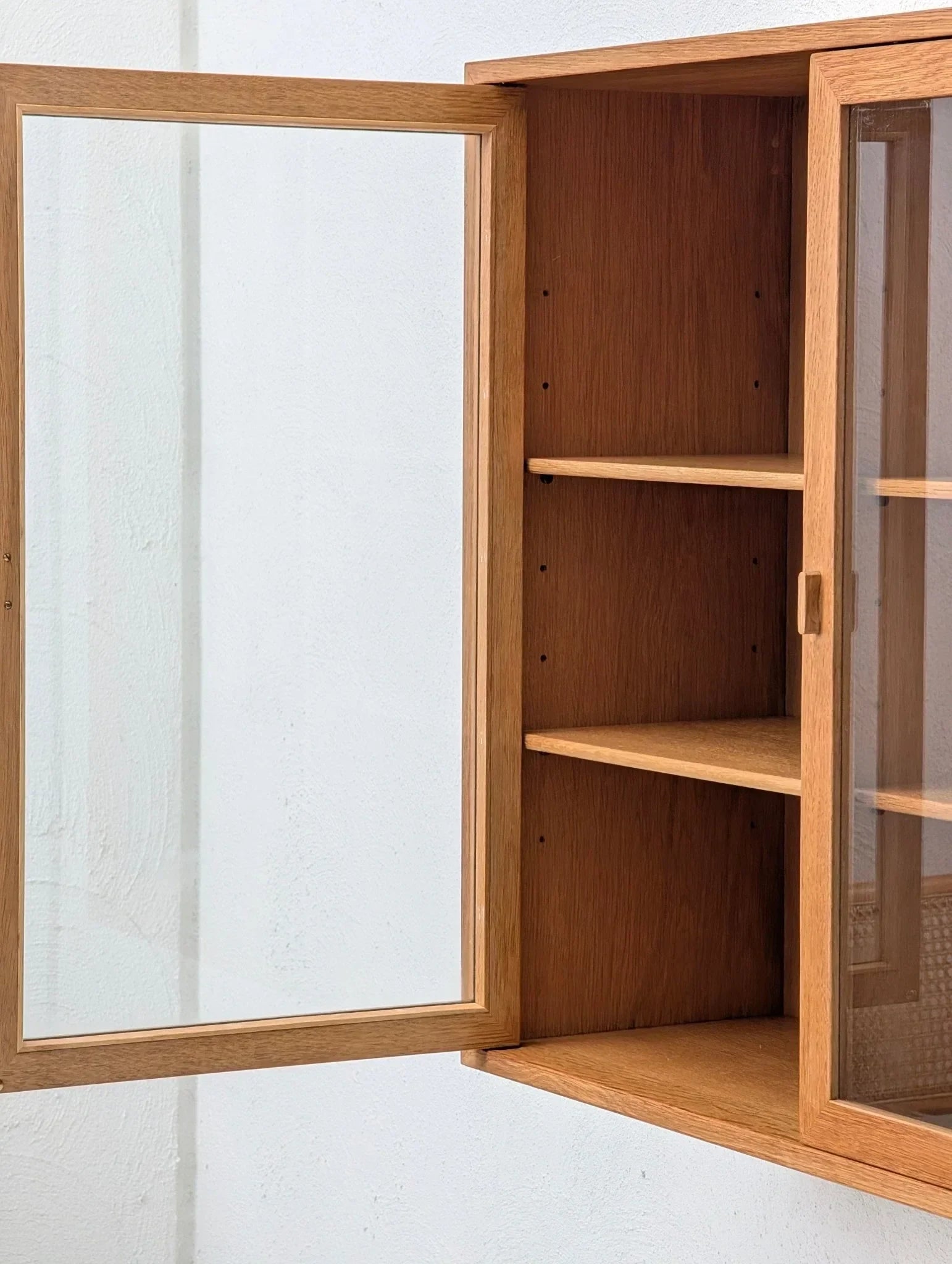 Mid-century oak and glass display cabinet with open door and shelves, Danish design