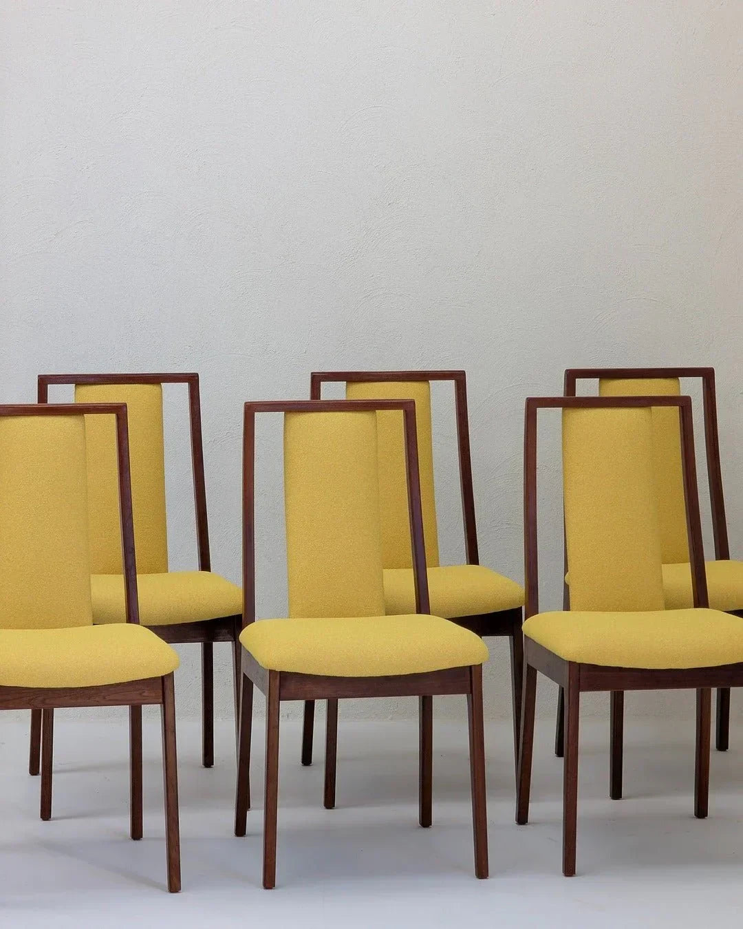 Set of six mid-century modern dining chairs with yellow upholstery and wooden frames