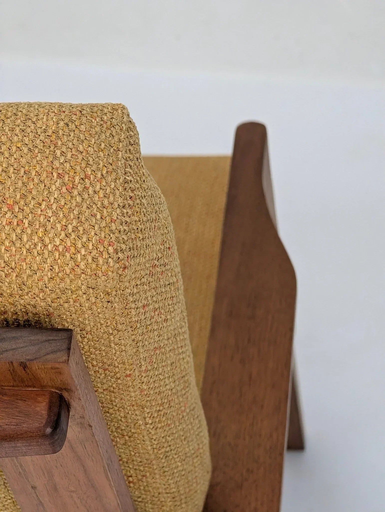 Mid-century modern solid teak lounge chair with textured mustard upholstery