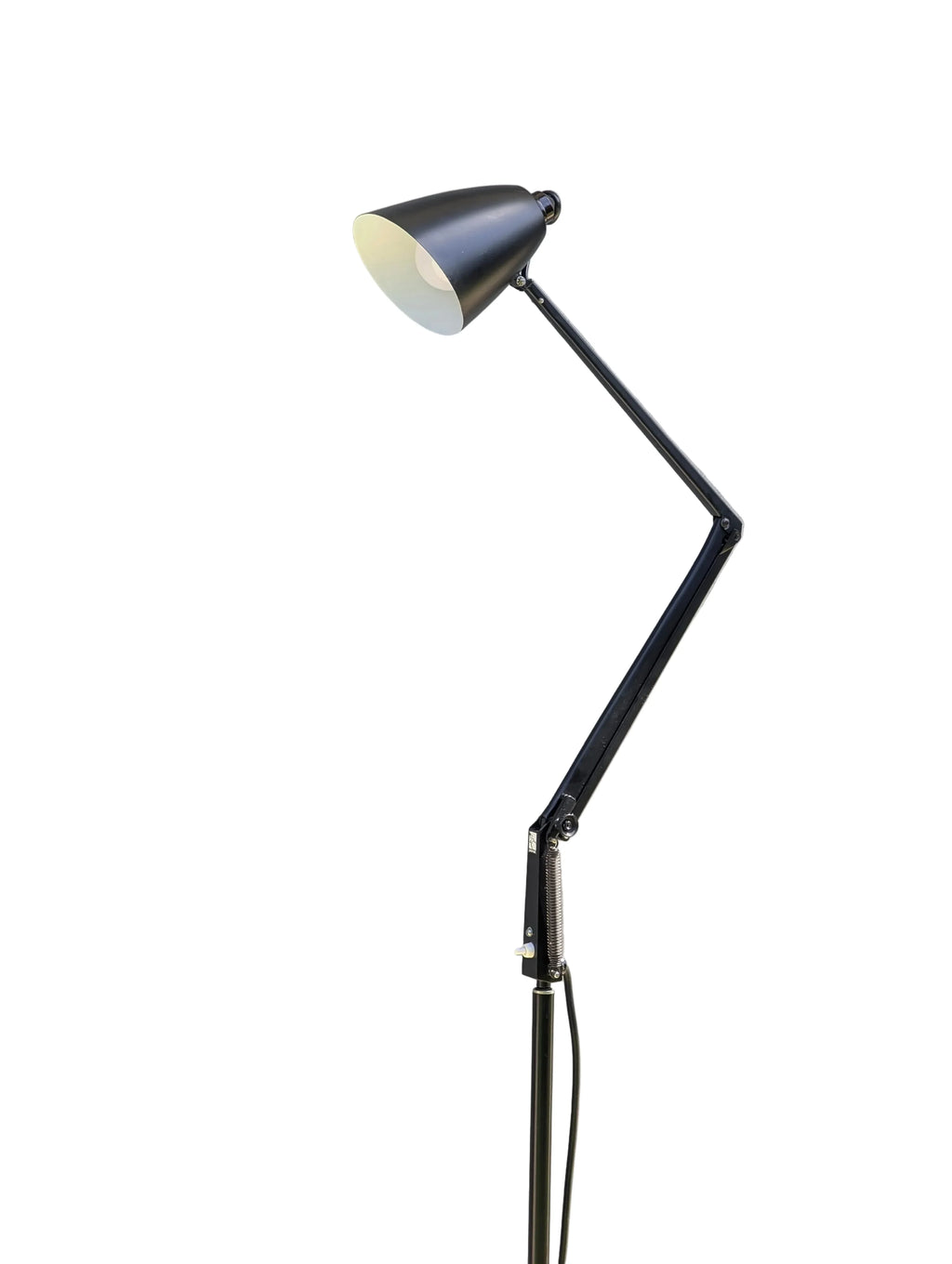 Adjustable black floor lamp with angled arm and conical shade on white background