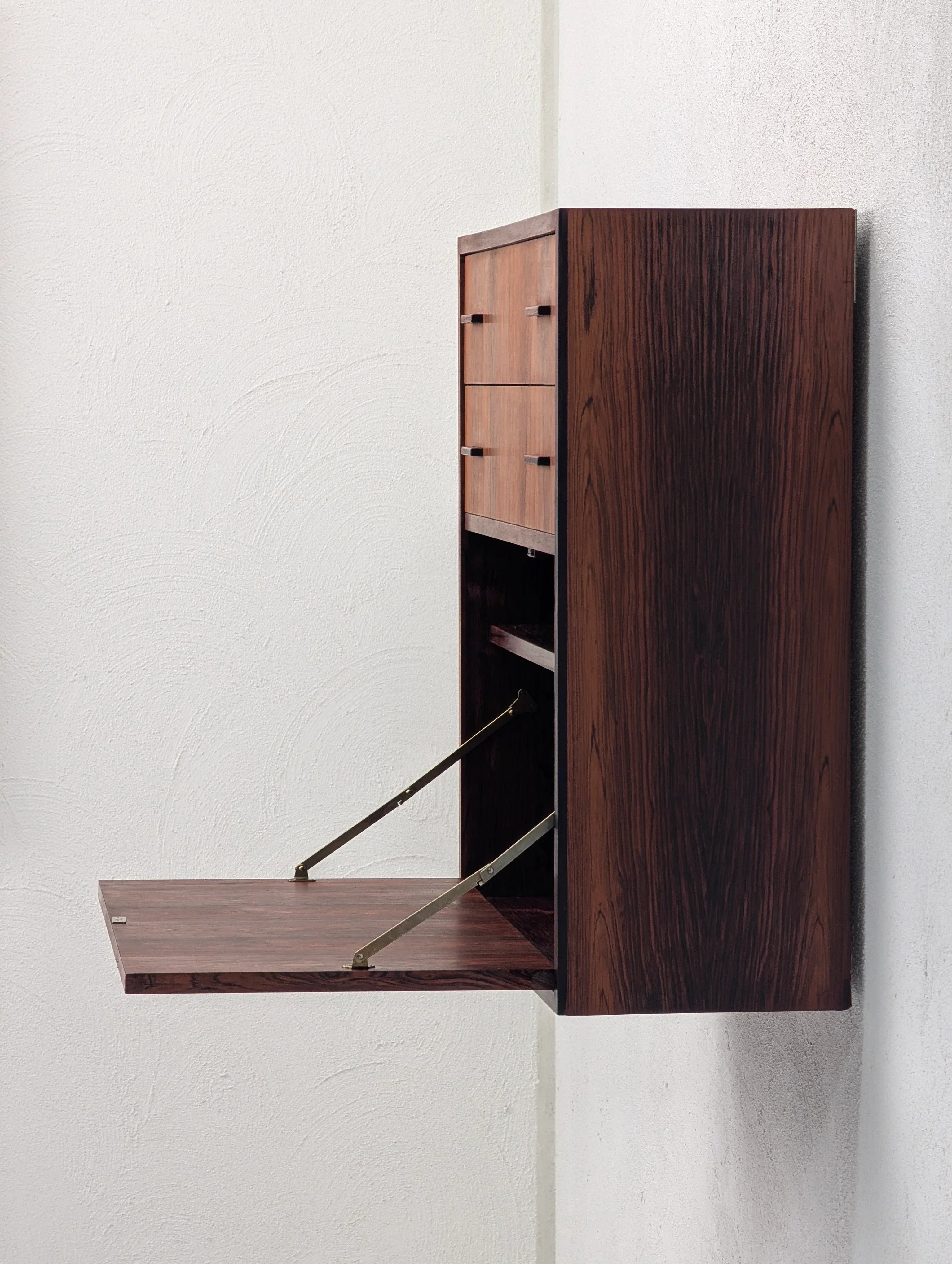 Wall-mounted rosewood cabinet with fold-down desk and three drawers, modern minimalist decor