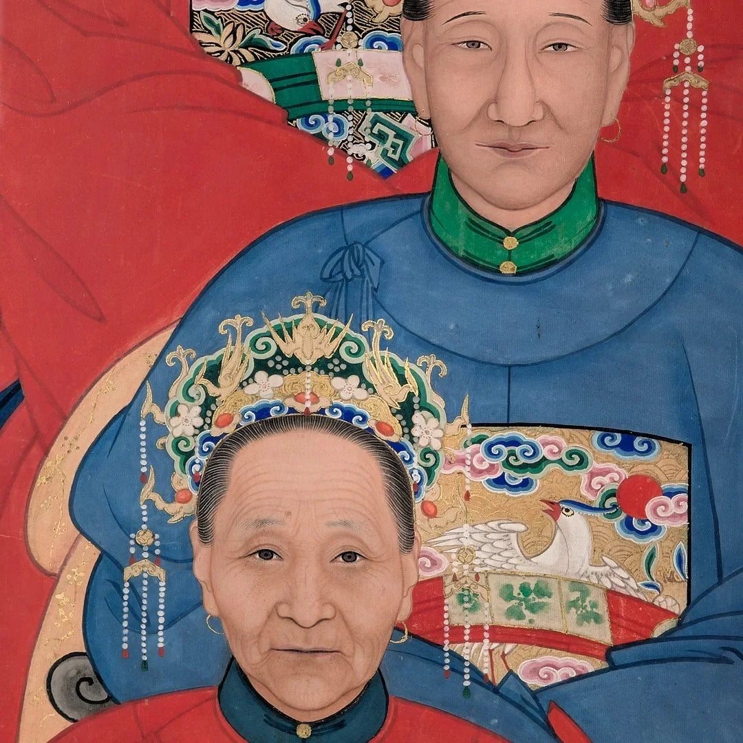 Chinese ancestor portrait of two people in traditional blue robes and ornate headdress