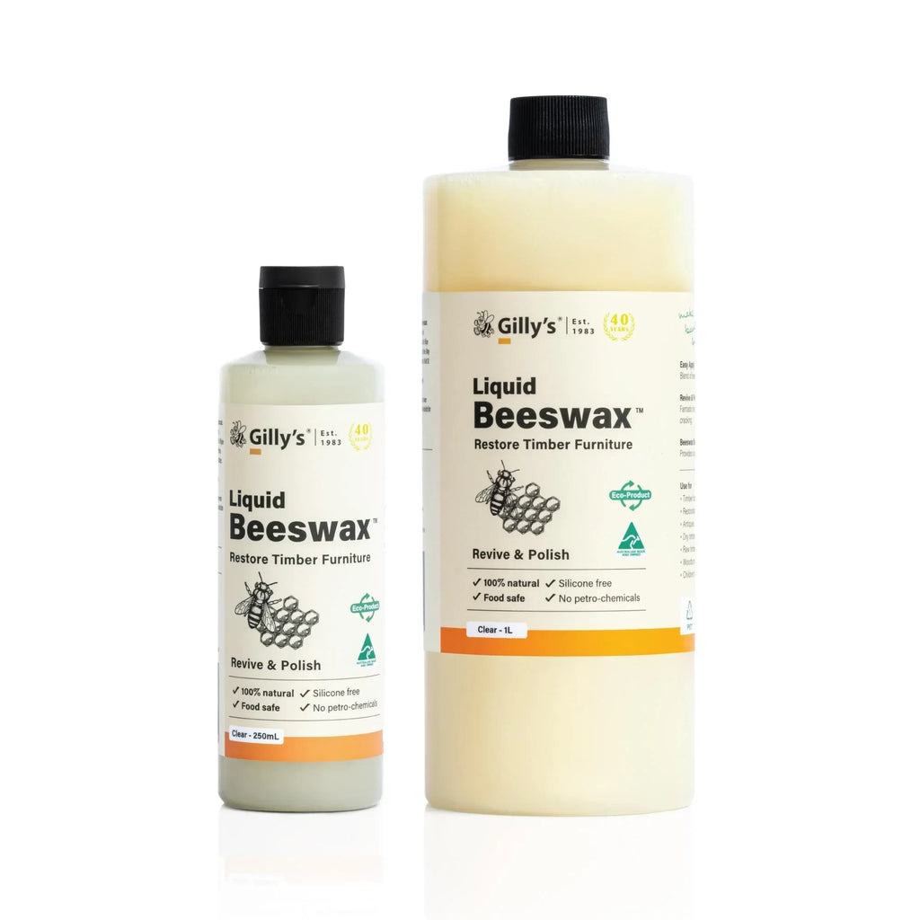 Gilly's Liquid Beeswax bottles for timber furniture restore and polish on white background