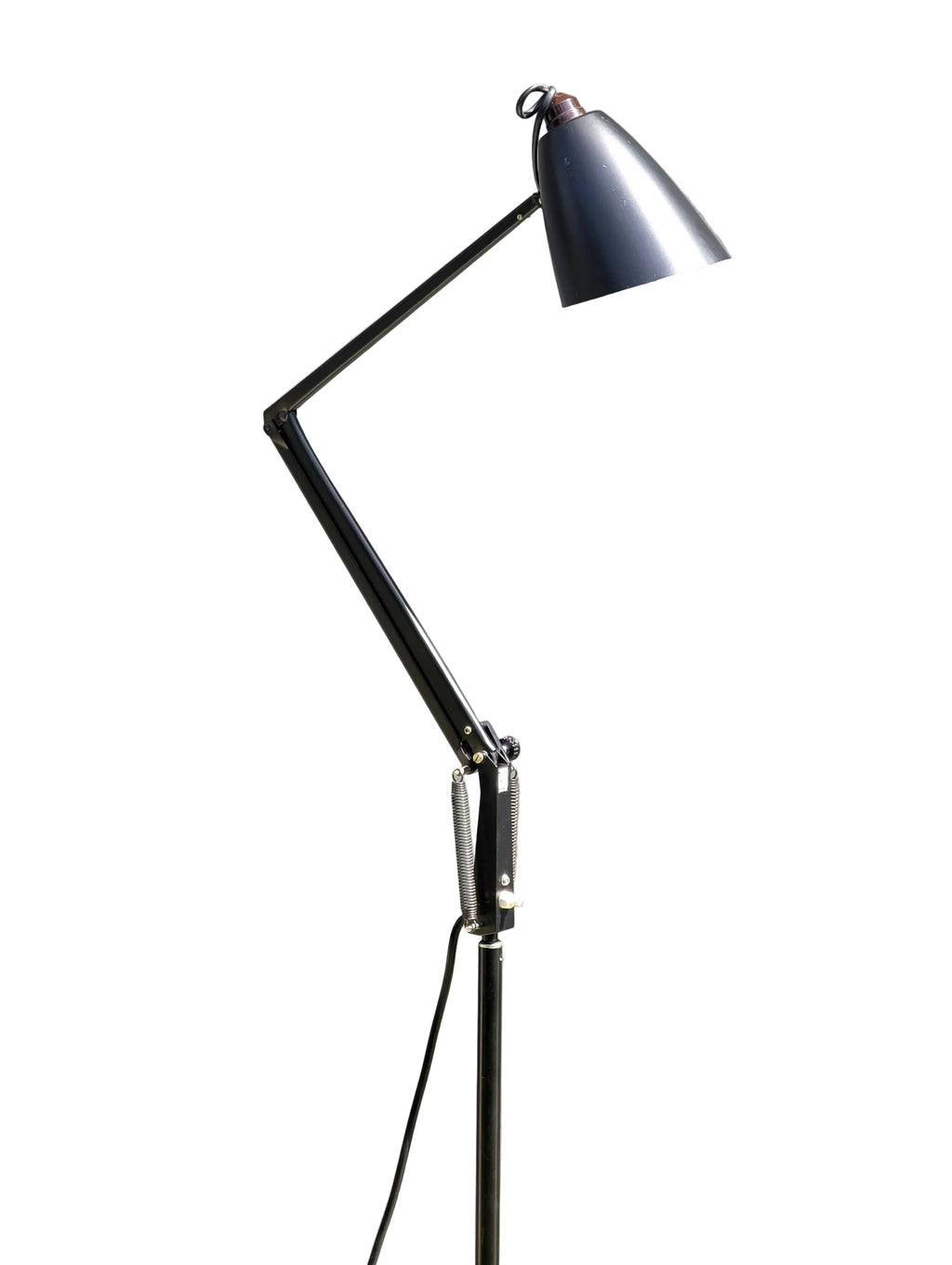 Black adjustable metal desk lamp with spring hinges and conical shade on white background
