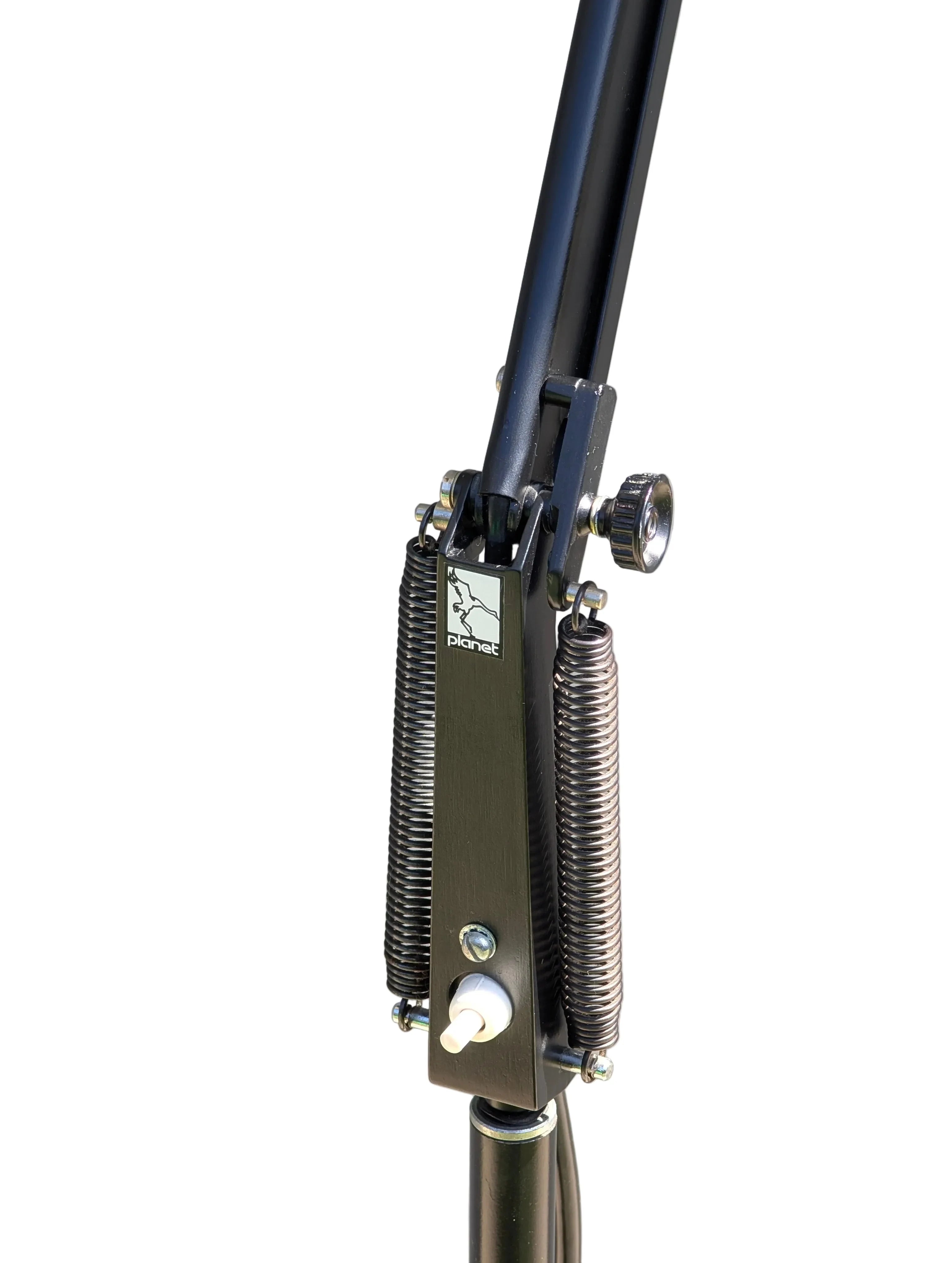 Close-up of black metal mechanism with two large springs and adjustment knob on microphone stand