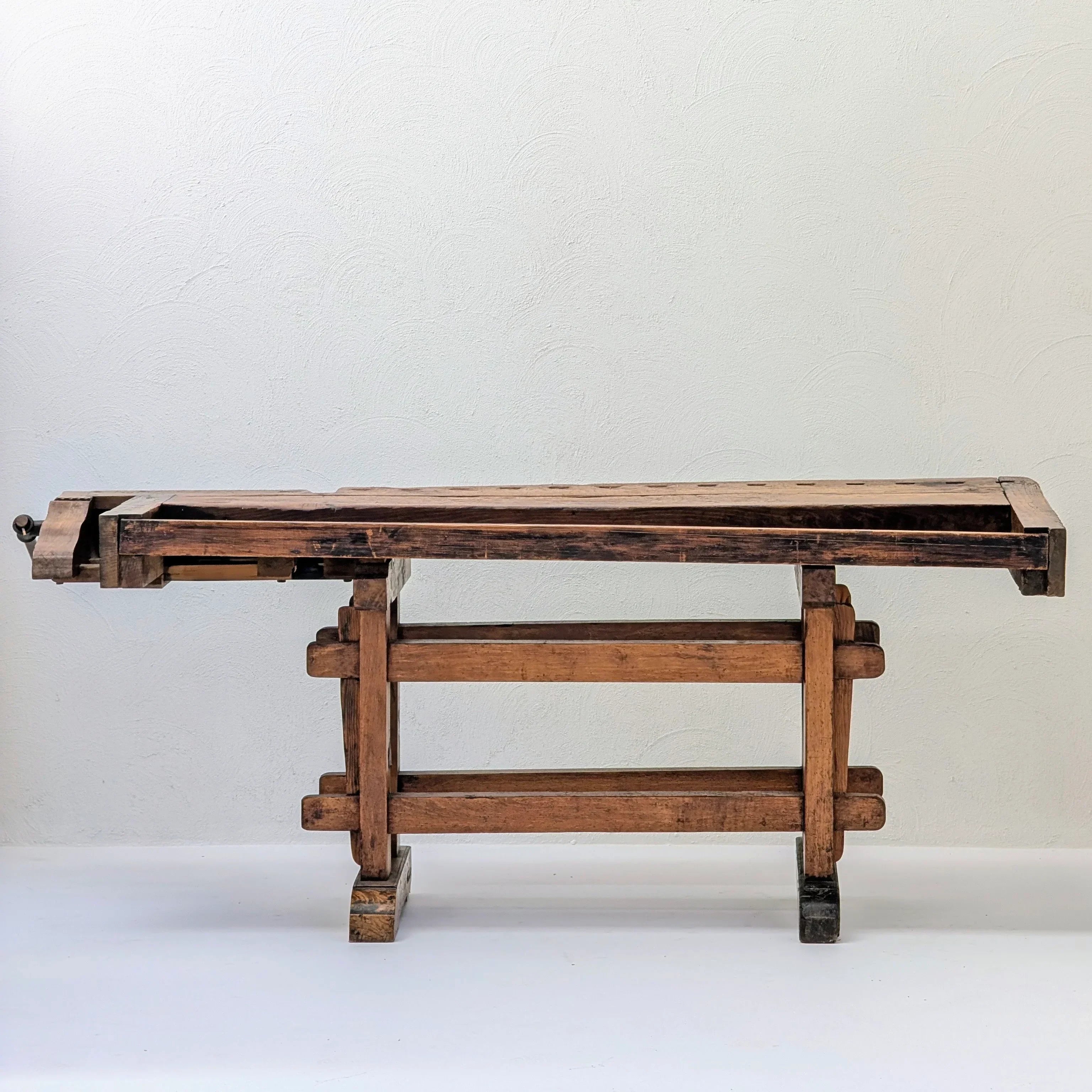 Antique wooden workbench on white background, rustic vintage woodworking table