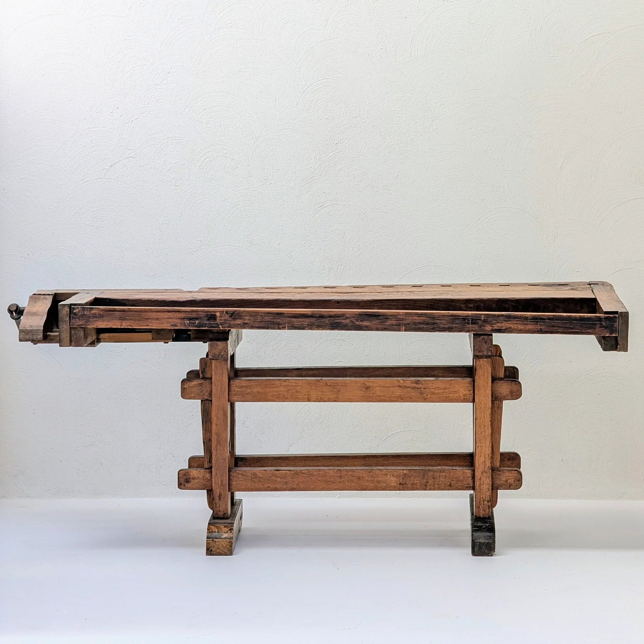 Antique wooden workbench on white background, rustic vintage woodworking table