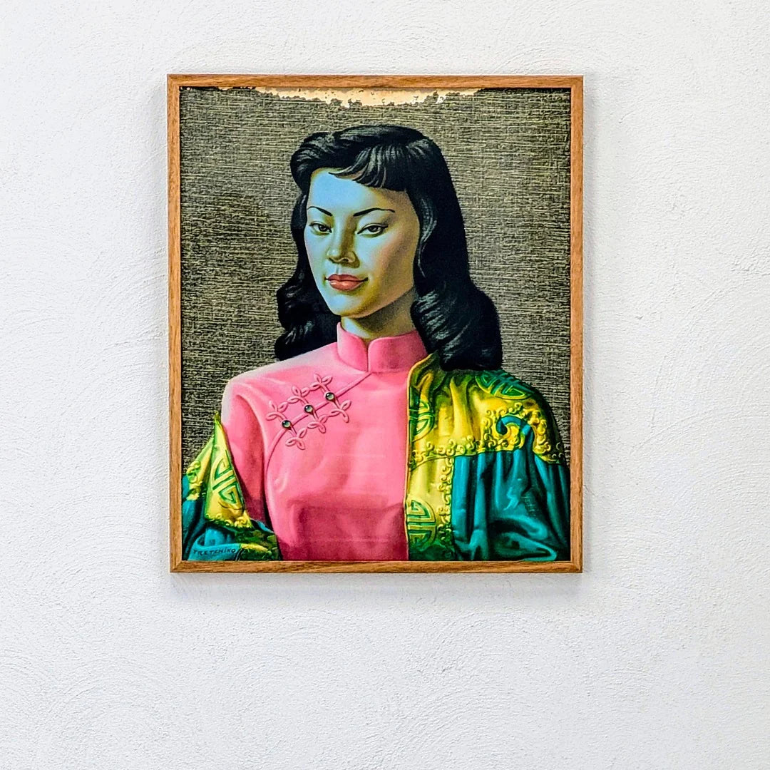 Framed portrait painting of a woman in a pink áo dài with embroidered details and silk robe