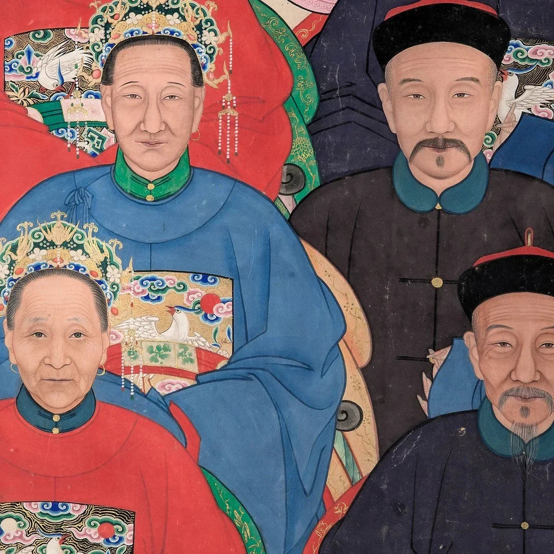 Traditional Chinese family portrait with ornate robes and elaborate headpieces