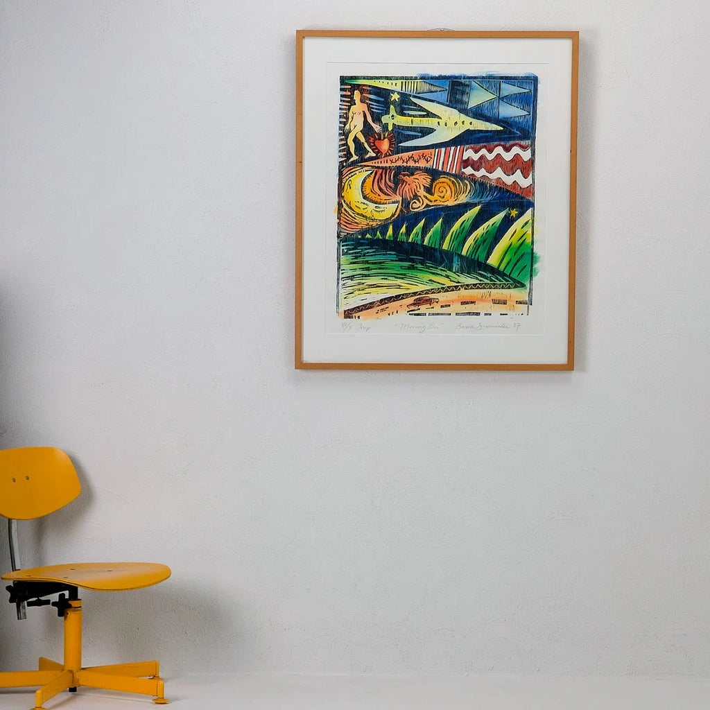 Colorful modern abstract art in wooden frame on white wall, yellow chair beside