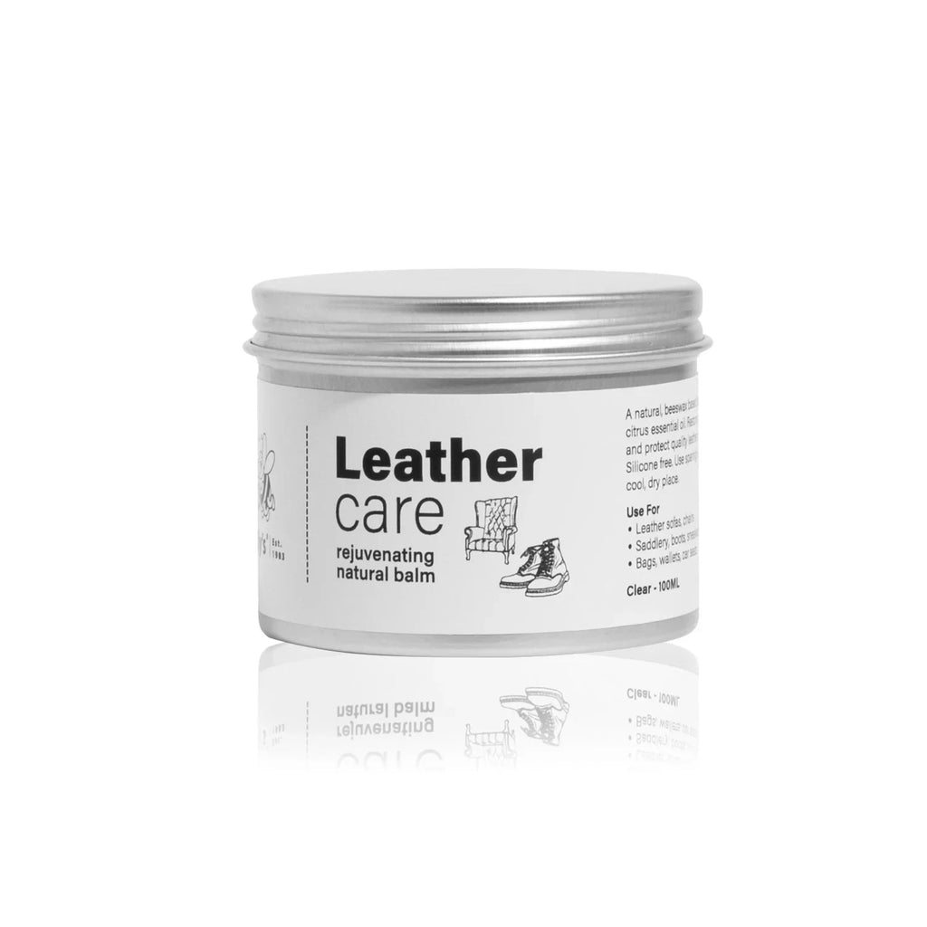 Leather care rejuvenating natural balm tin with black text and product illustrations on label