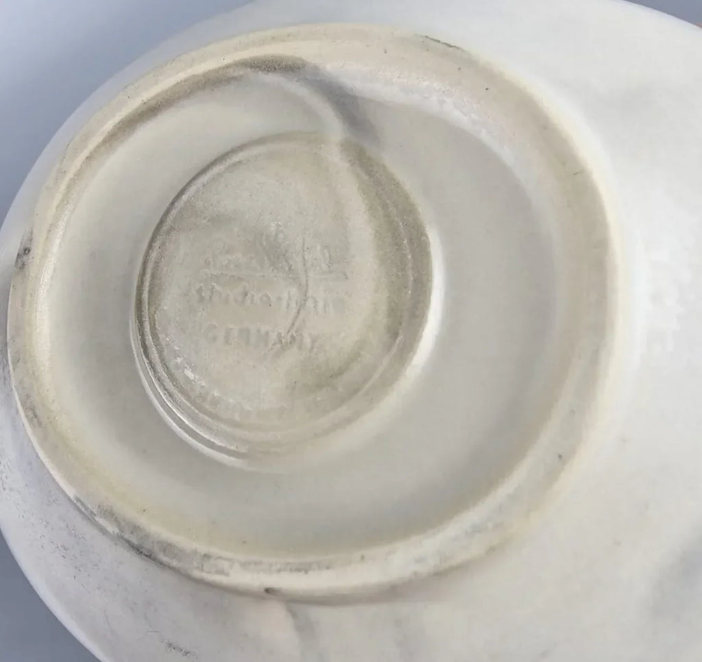 Vintage porcelain figurine base with faint Germany maker's mark and embossed stamp