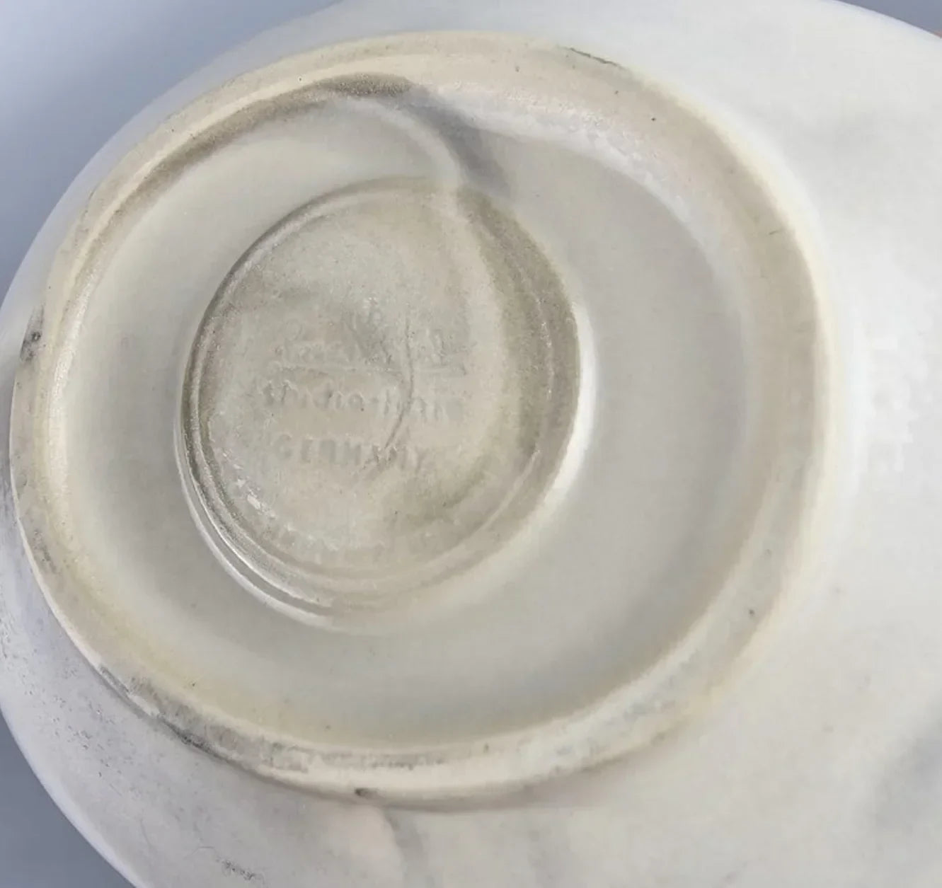 Vintage porcelain figurine base with faint Germany maker's mark and embossed stamp