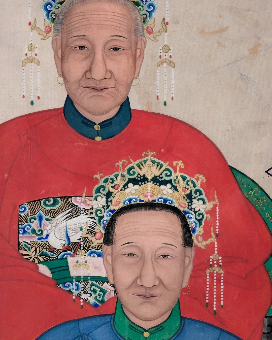 Chinese ancestor portrait with two elders in traditional robes and ornate headpieces