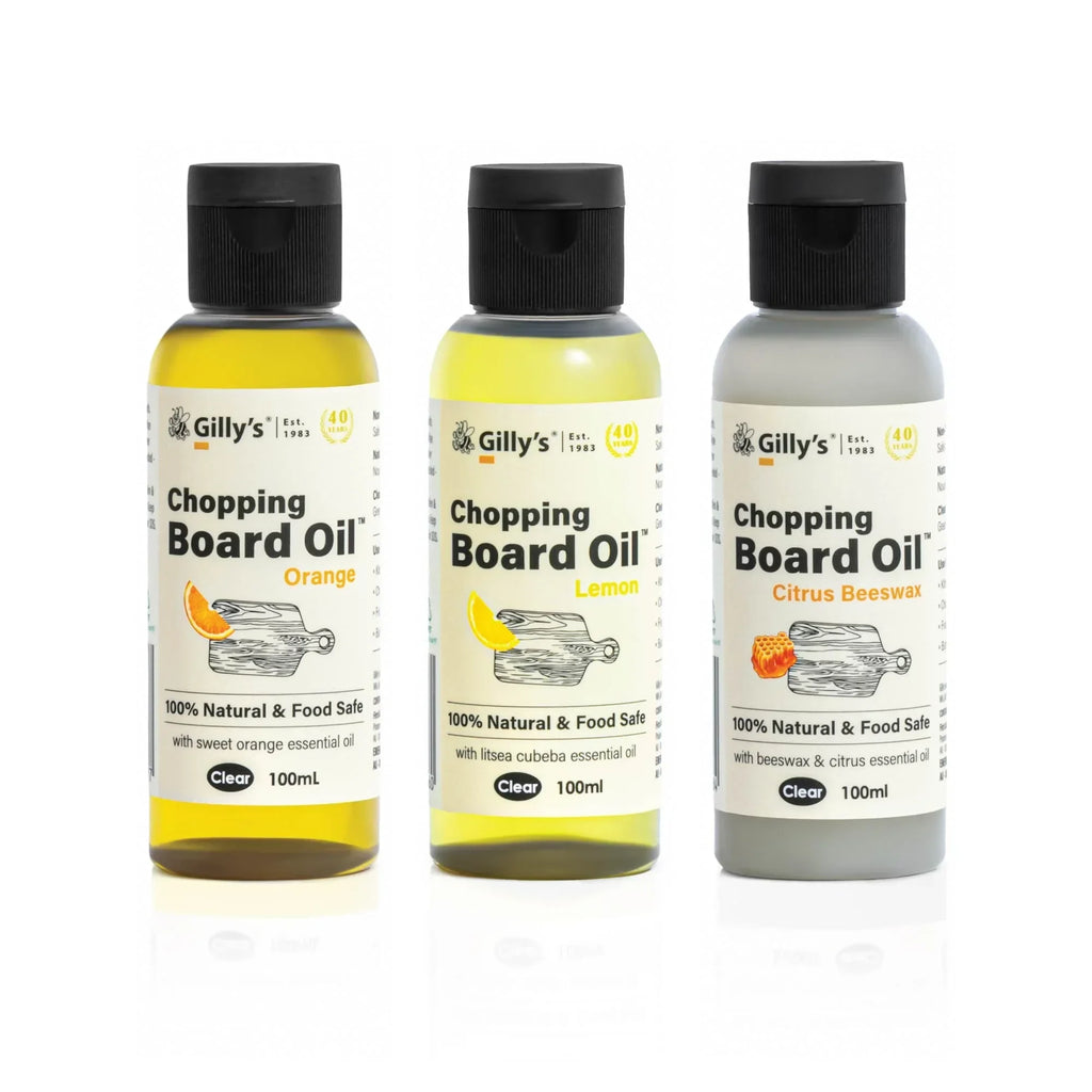 Three Gilly's 100ml chopping board oil bottles—orange, lemon, citrus beeswax—food safe.