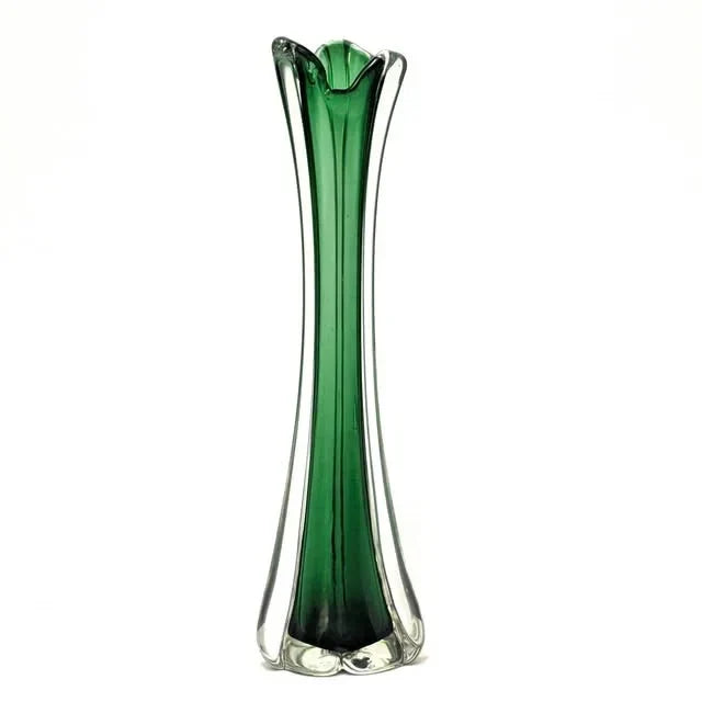 Tall green glass vase with clear edges on a white background