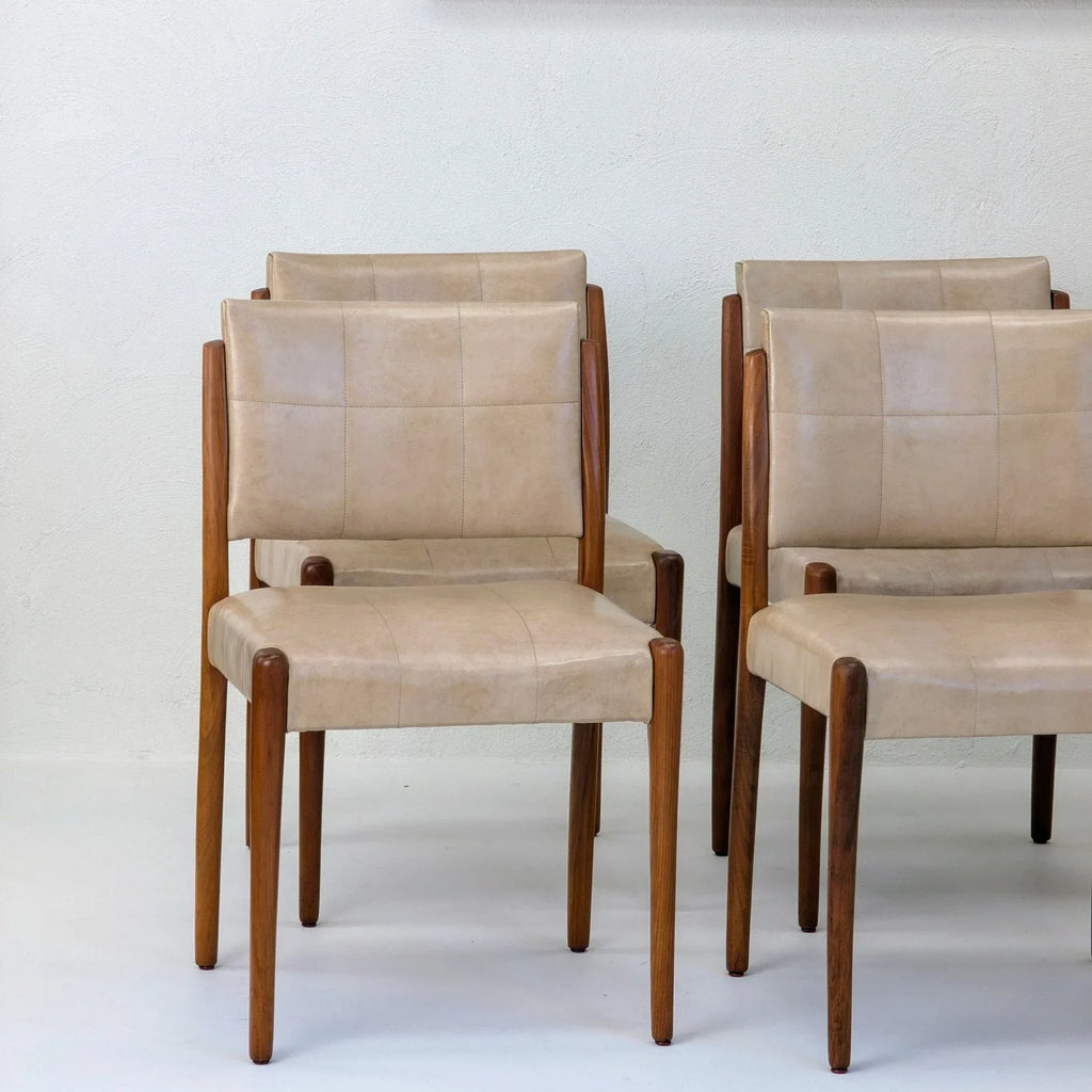Set of six Fler dining chairs in light tan upholstery with blackwood frames