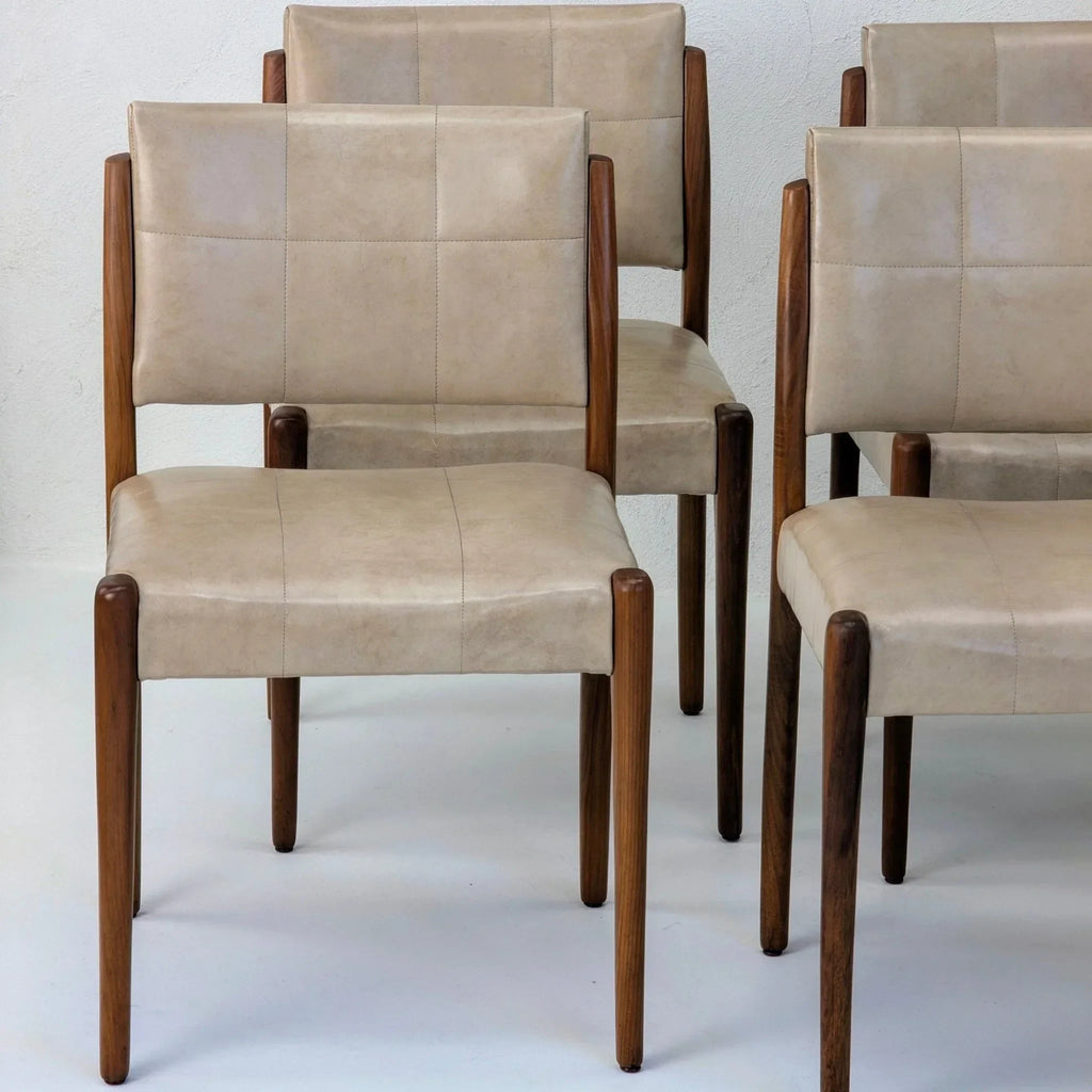 Set of six beige Fler dining chairs with blackwood legs on light background