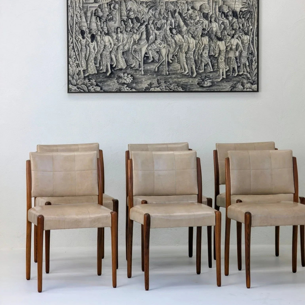 Set of six mid-century modern dining chairs with beige leather upholstery and wooden frames
