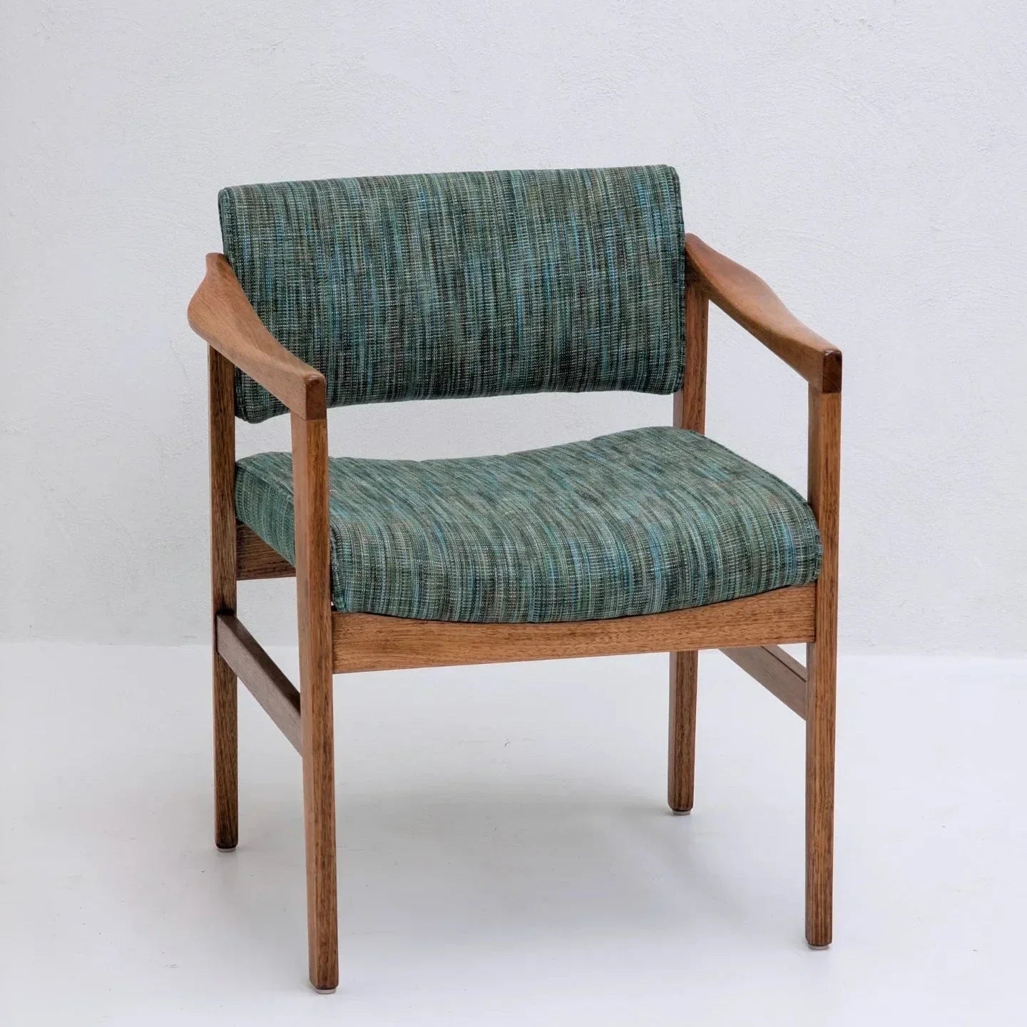 Mid-century modern rosewood armchair with green-blue upholstered seat and backrest
