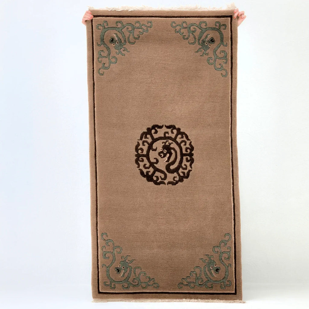 Tibetan handmade wool khaden rug with dragon motifs and brown central medallion