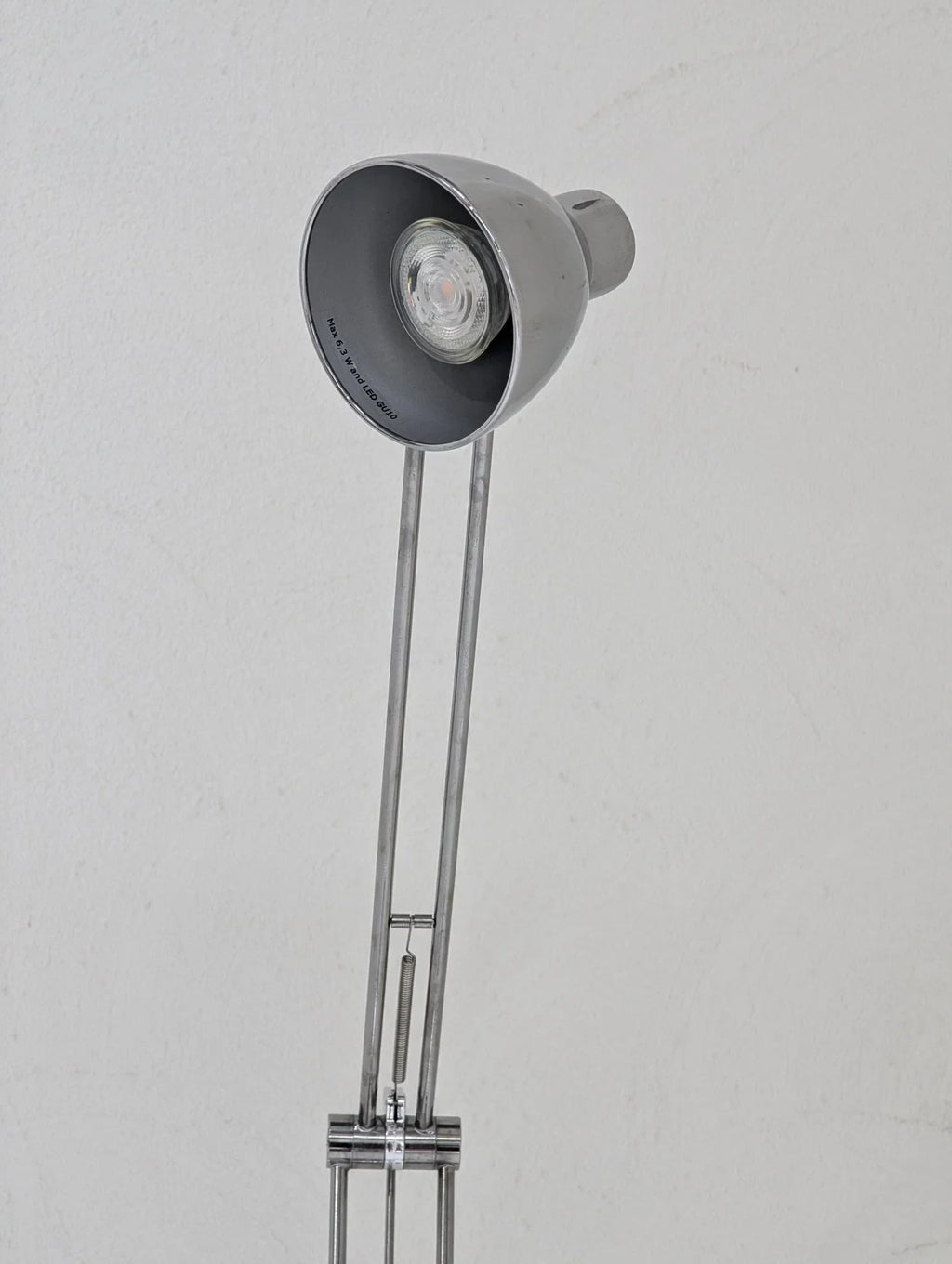 Vintage IKEA Antifoni floor lamp with adjustable chrome arm and gray metal shade.