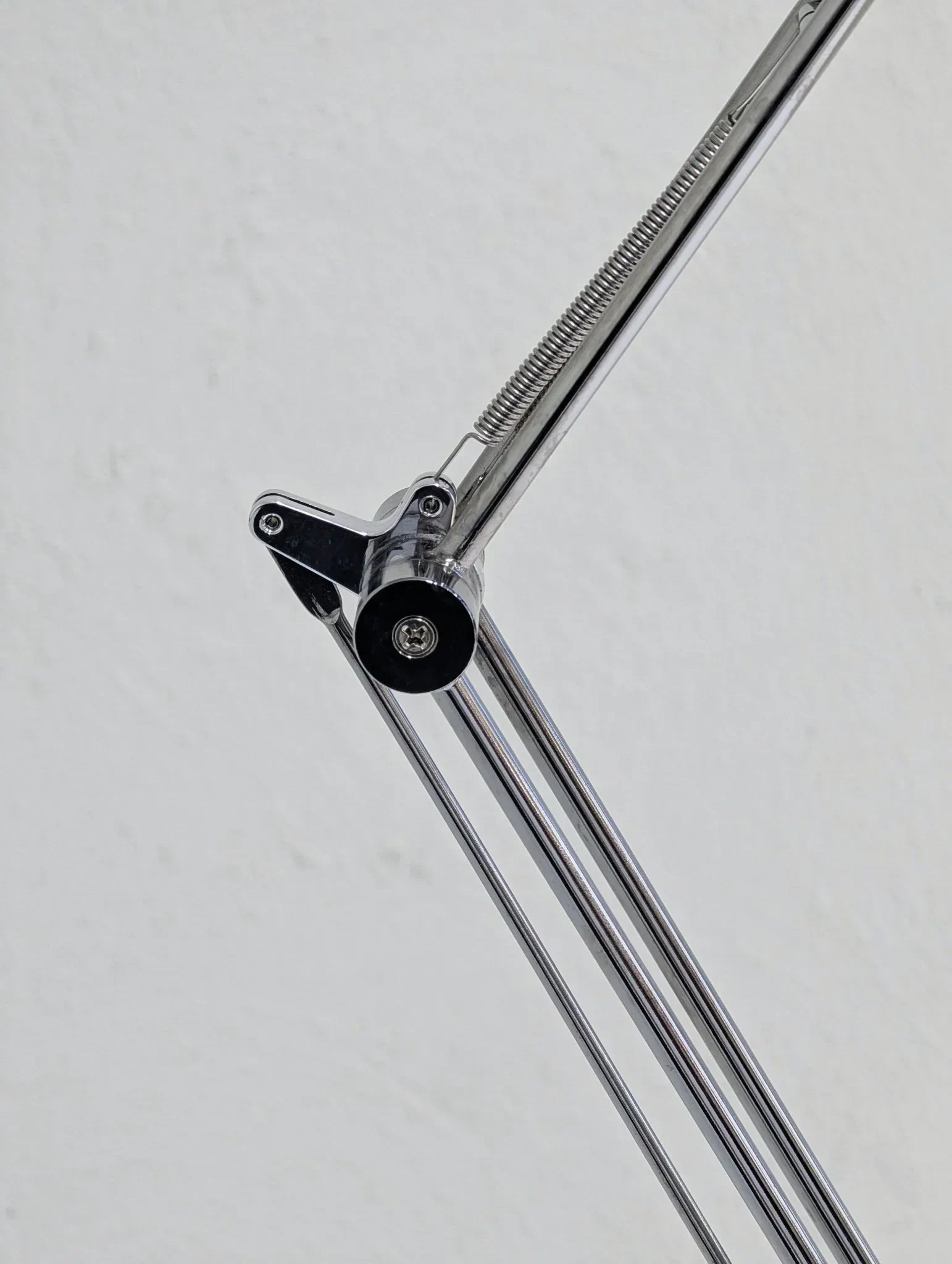 Close-up of vintage IKEA Antifoni floor lamp chrome adjustable arm and spring