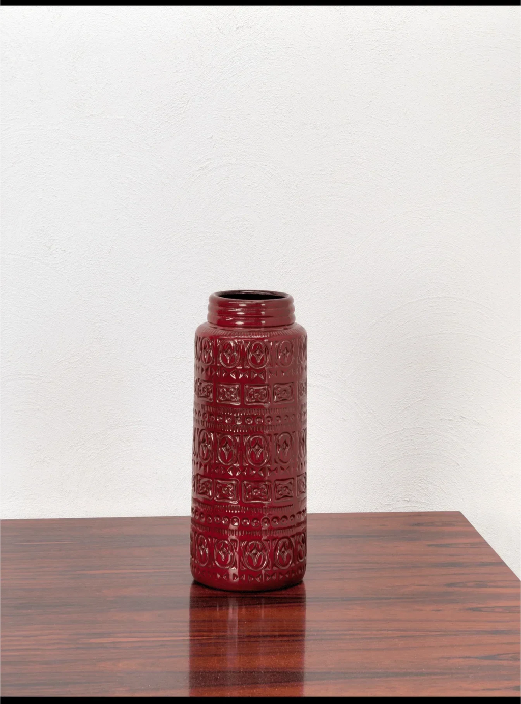 West German Scheurich red ceramic vase with geometric pattern on wood table